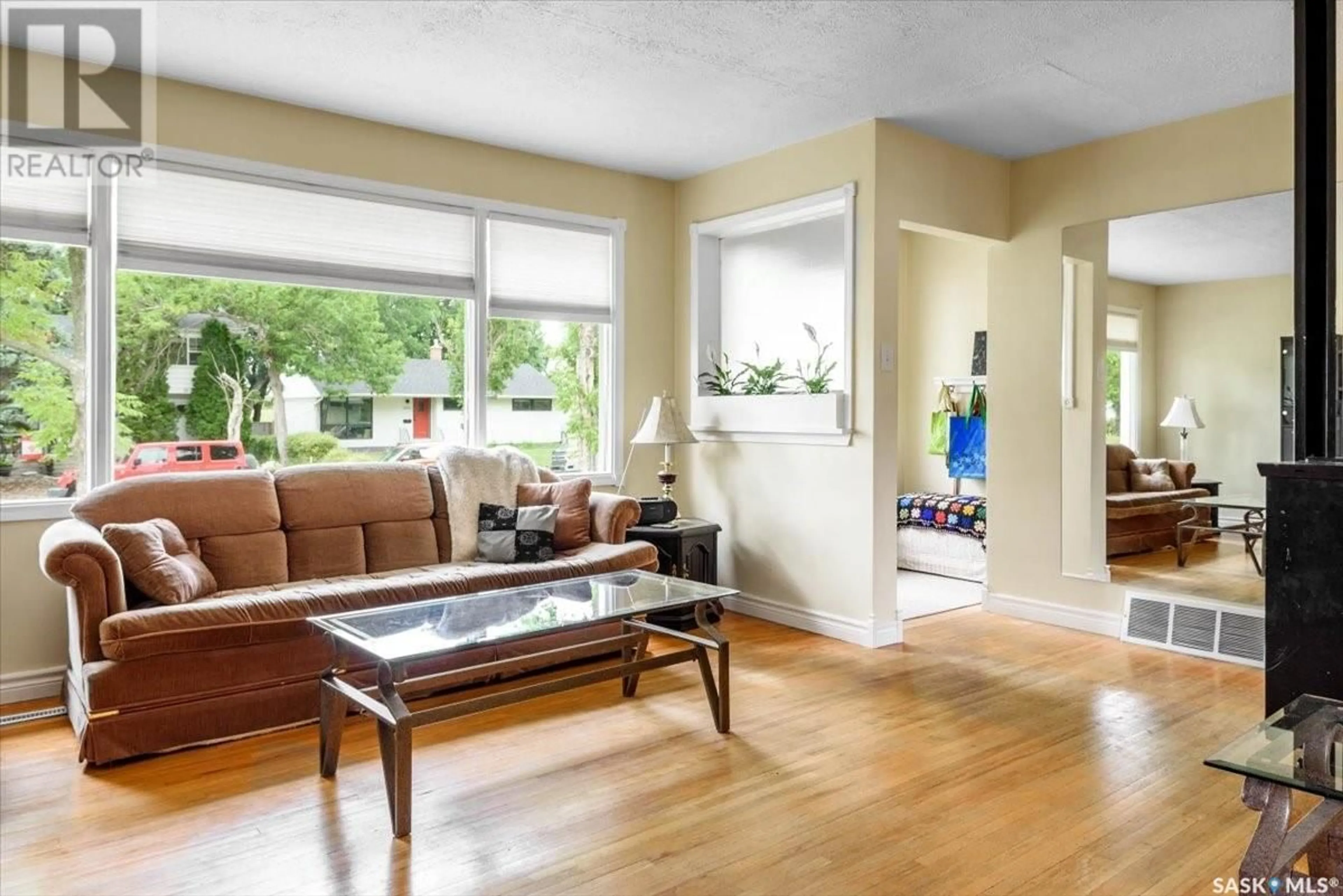 Living room with furniture, wood/laminate floor for 2621 EDWARD STREET, Regina Saskatchewan S4S0N2