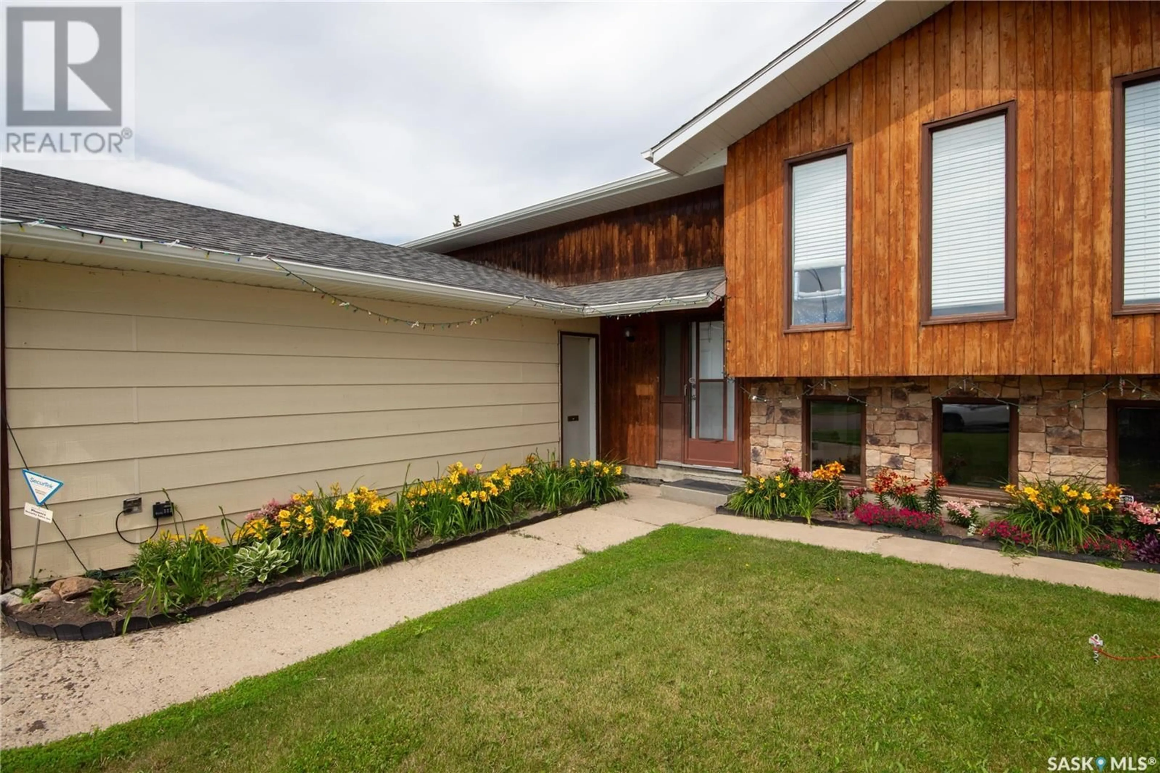 Home with brick exterior material, street for 11334 CLARK DRIVE, North Battleford Saskatchewan S9A3P3
