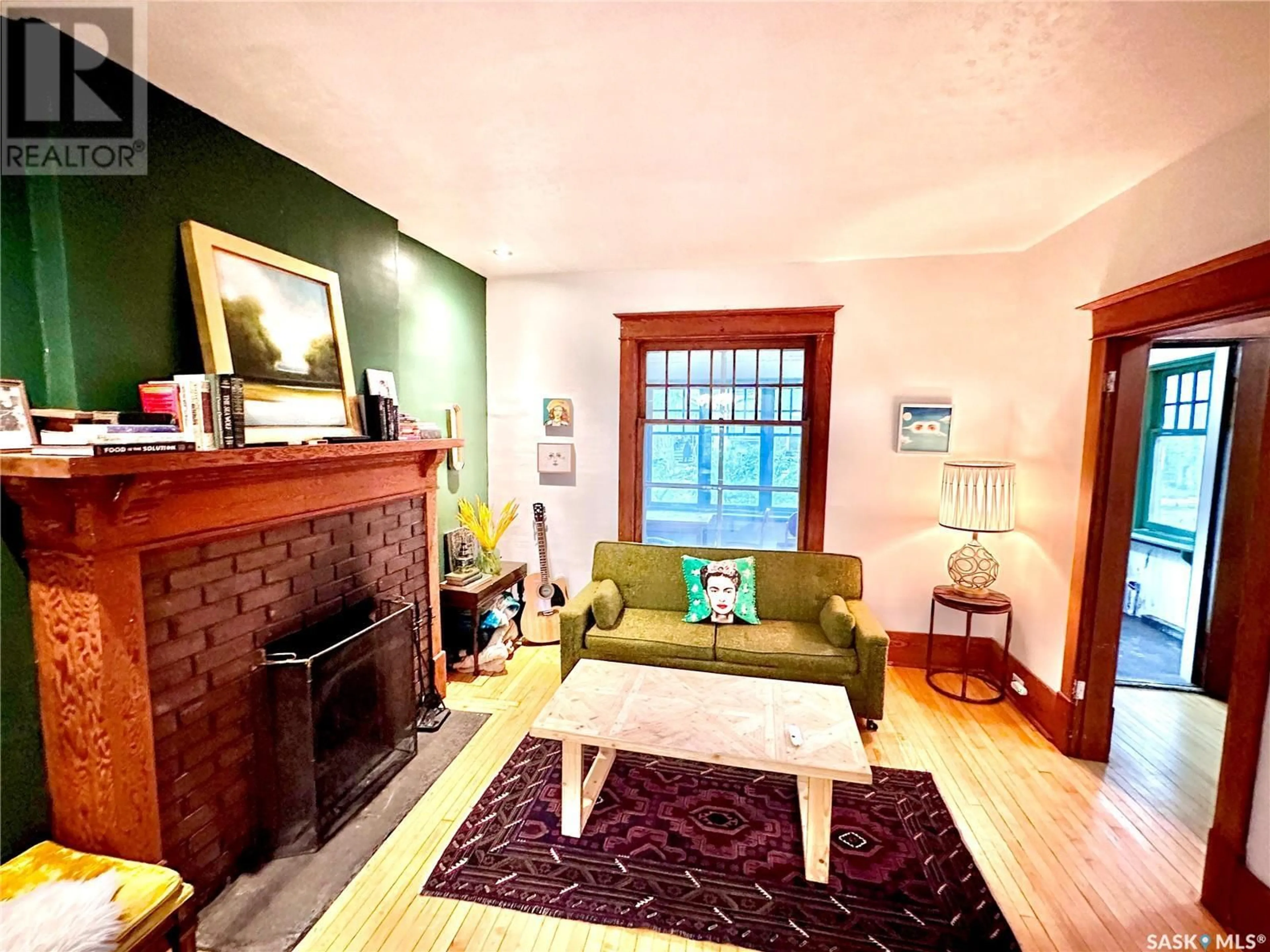 Living room with furniture, wood/laminate floor for 2343 QUEBEC STREET, Regina Saskatchewan S4P1K5