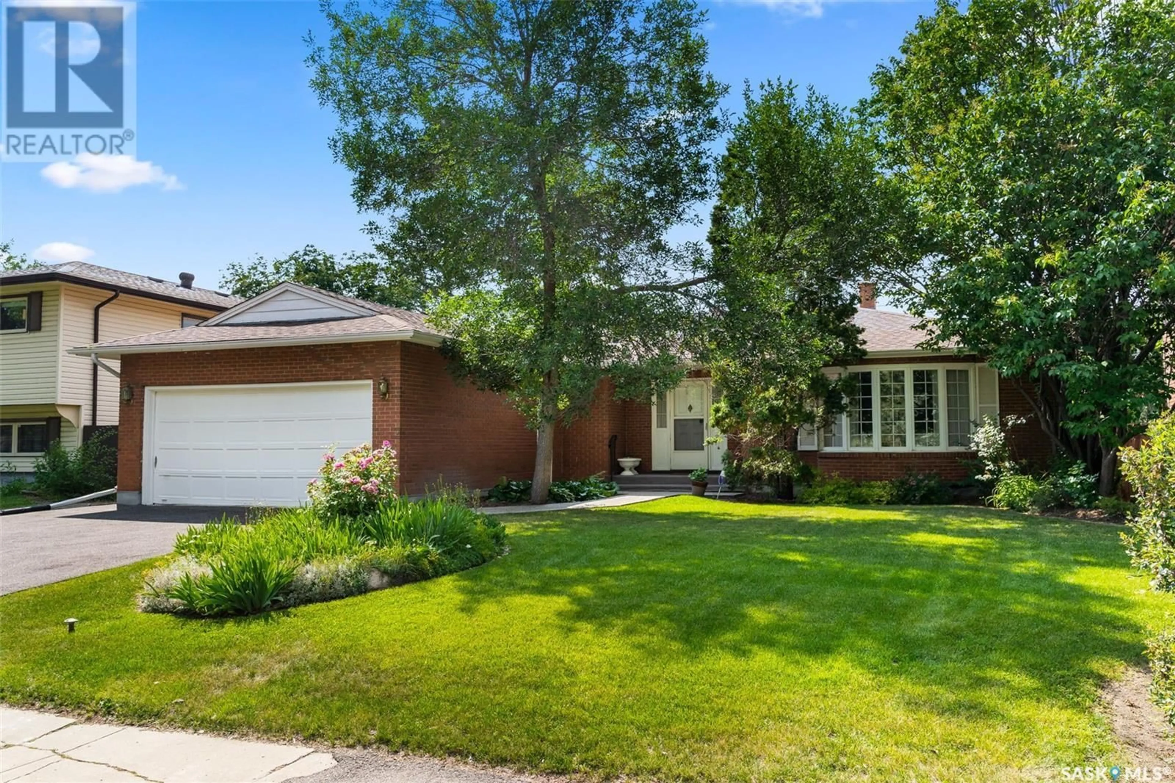 Home with brick exterior material, street for 962 MCNIVEN AVENUE, Regina Saskatchewan S4S3X3