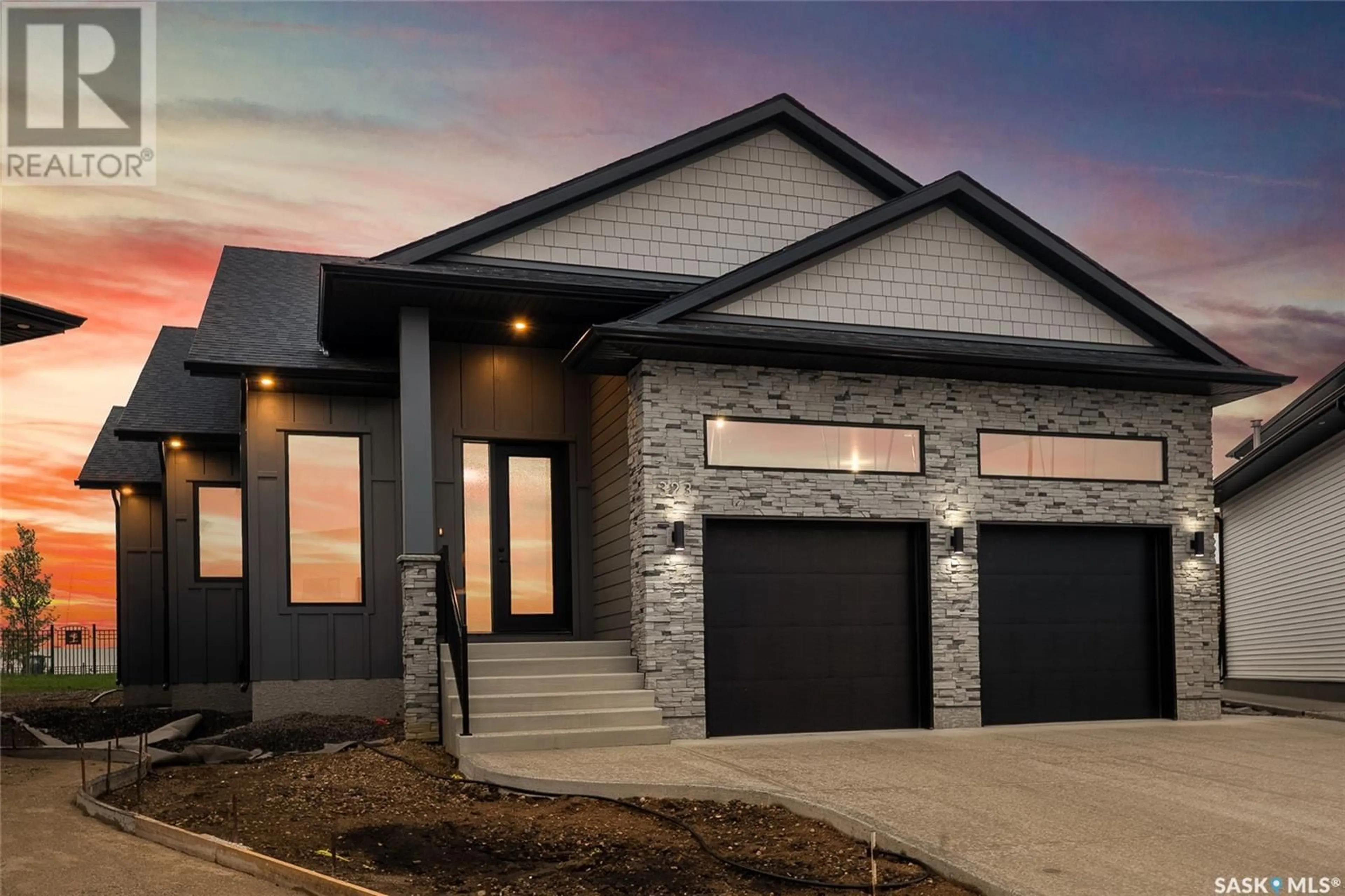 Home with brick exterior material, street for 323 WOOLF BAY, Saskatoon Saskatchewan S7W1E5