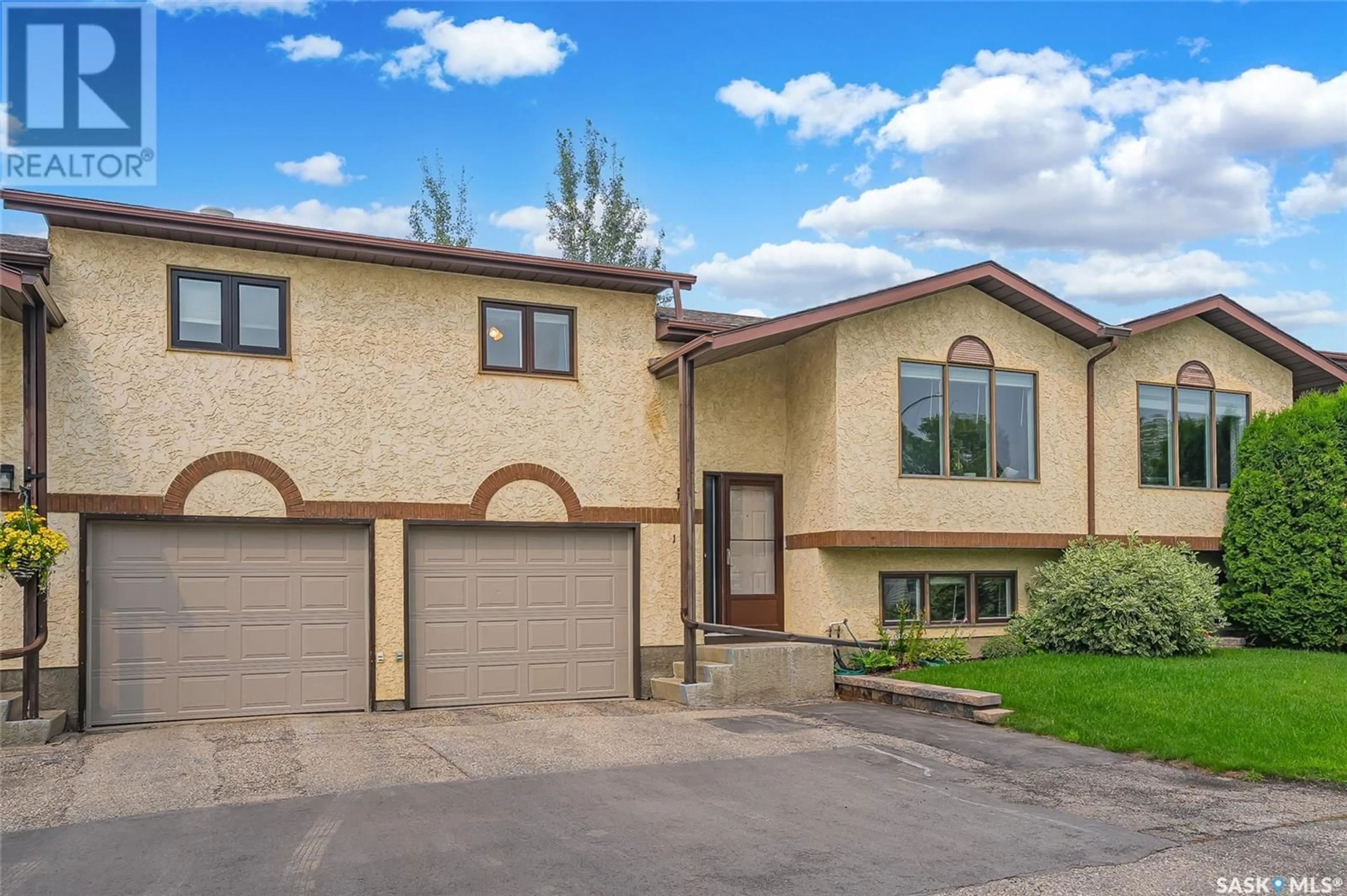 Home with vinyl exterior material, street for 2420 - 104 KENDERDINE ROAD, Saskatoon Saskatchewan S7N4G6