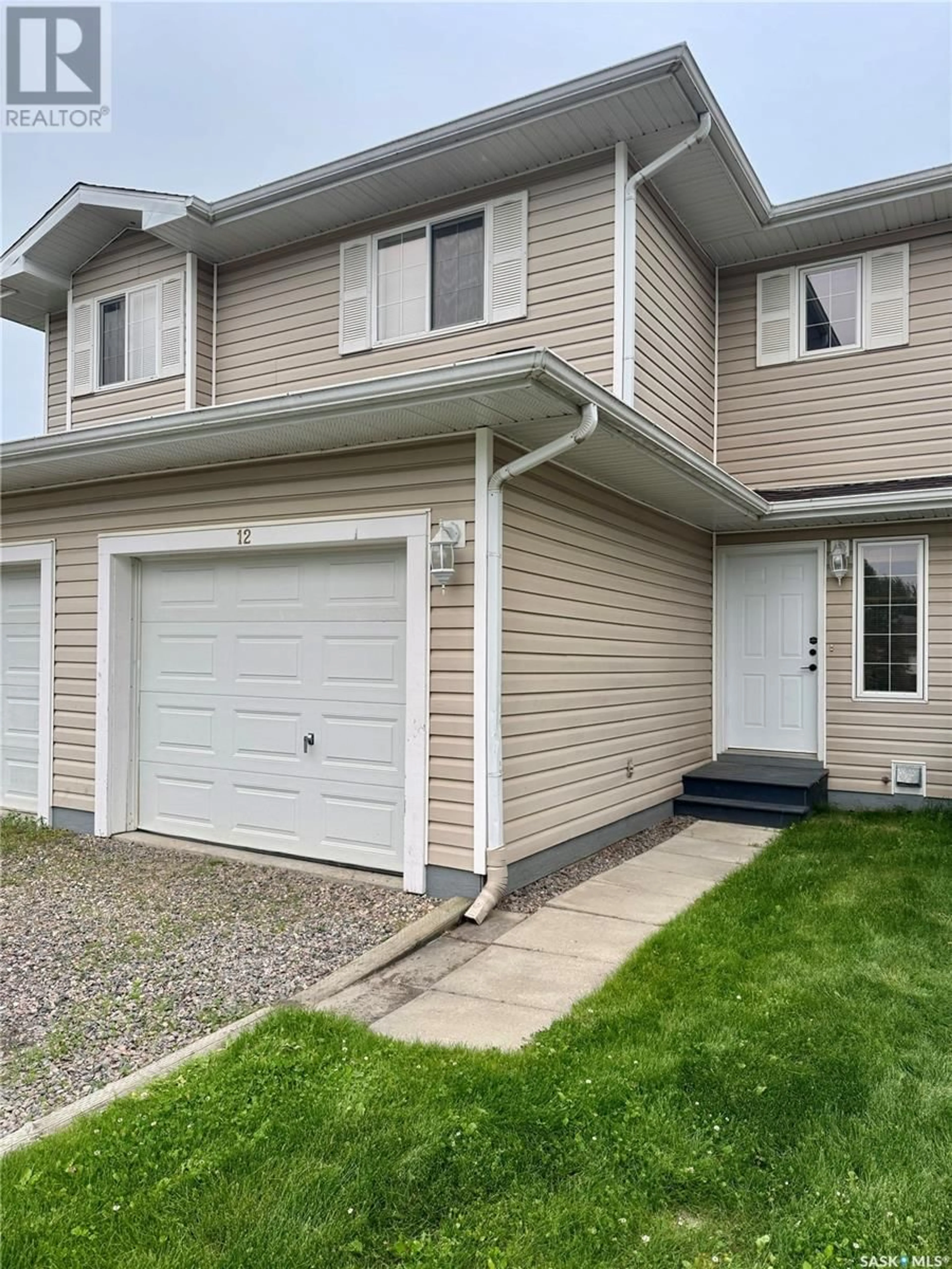Home with vinyl exterior material, street for 12 1327 STUDER STREET, La Ronge Saskatchewan S0J1L0