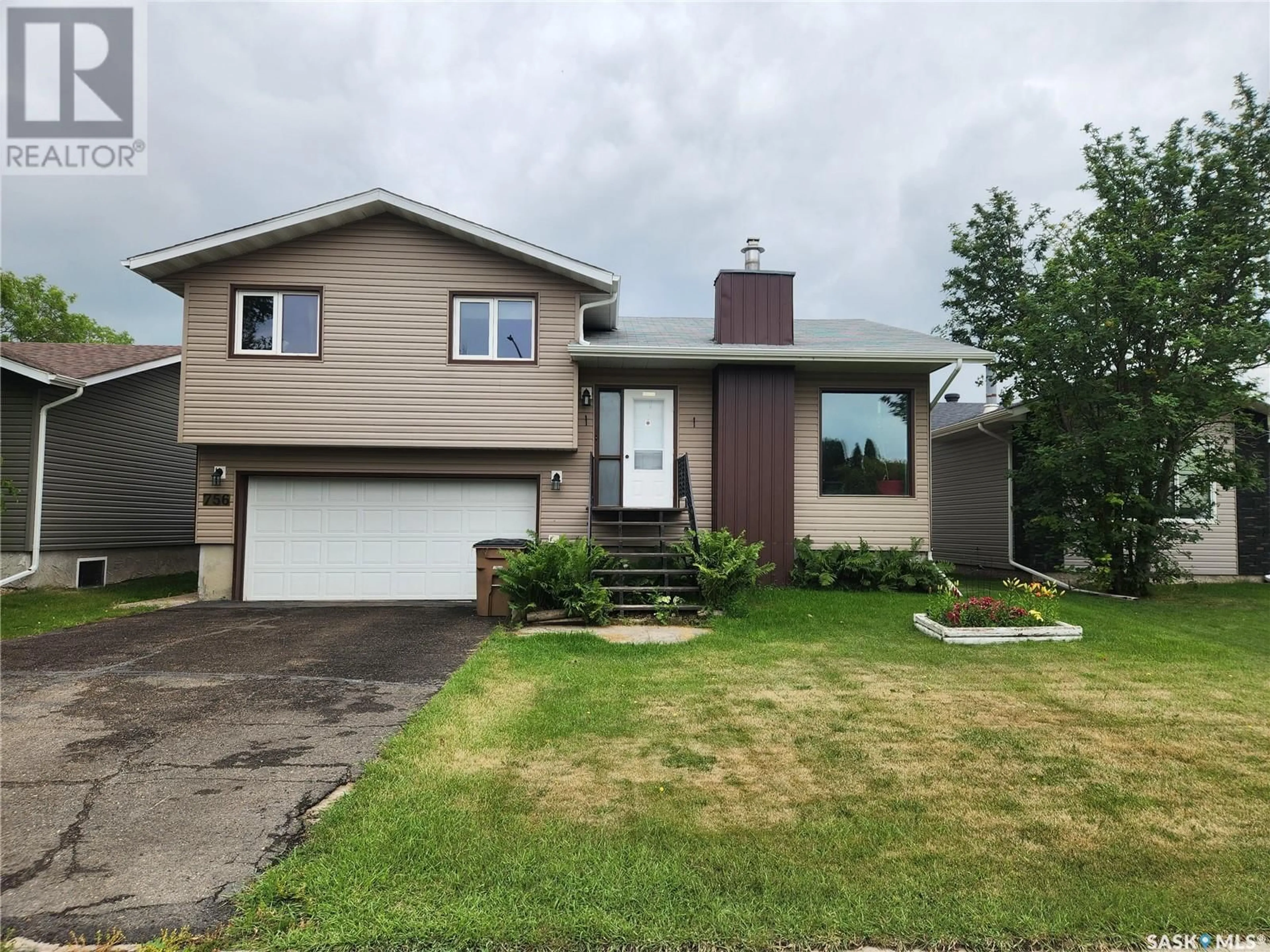 Home with vinyl exterior material, street for 756 GOLBURN CRESCENT, Tisdale Saskatchewan S0E1T0