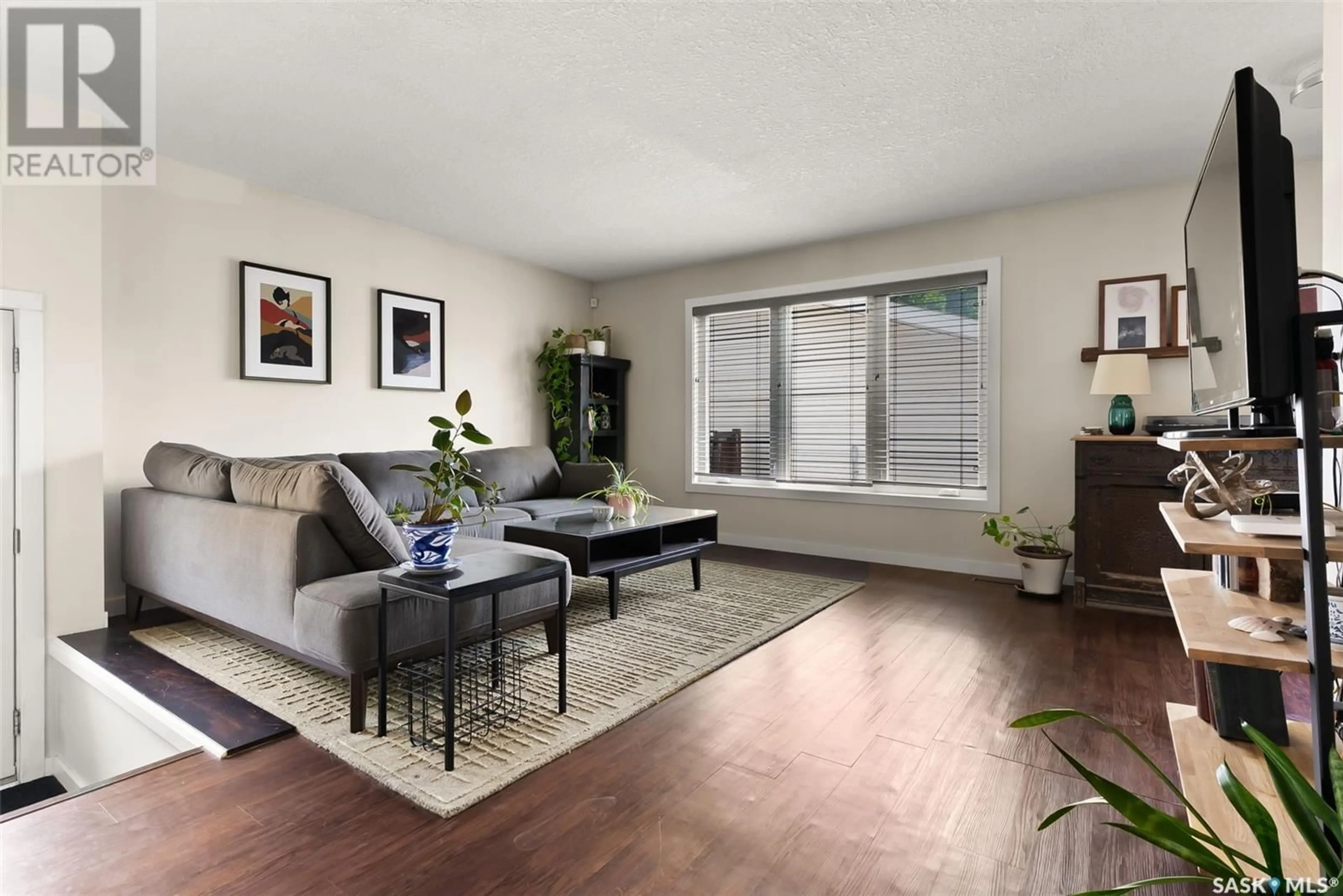 Living room with furniture, wood/laminate floor for 1118 FERGUSON CRESCENT, Regina Saskatchewan S4N6V4