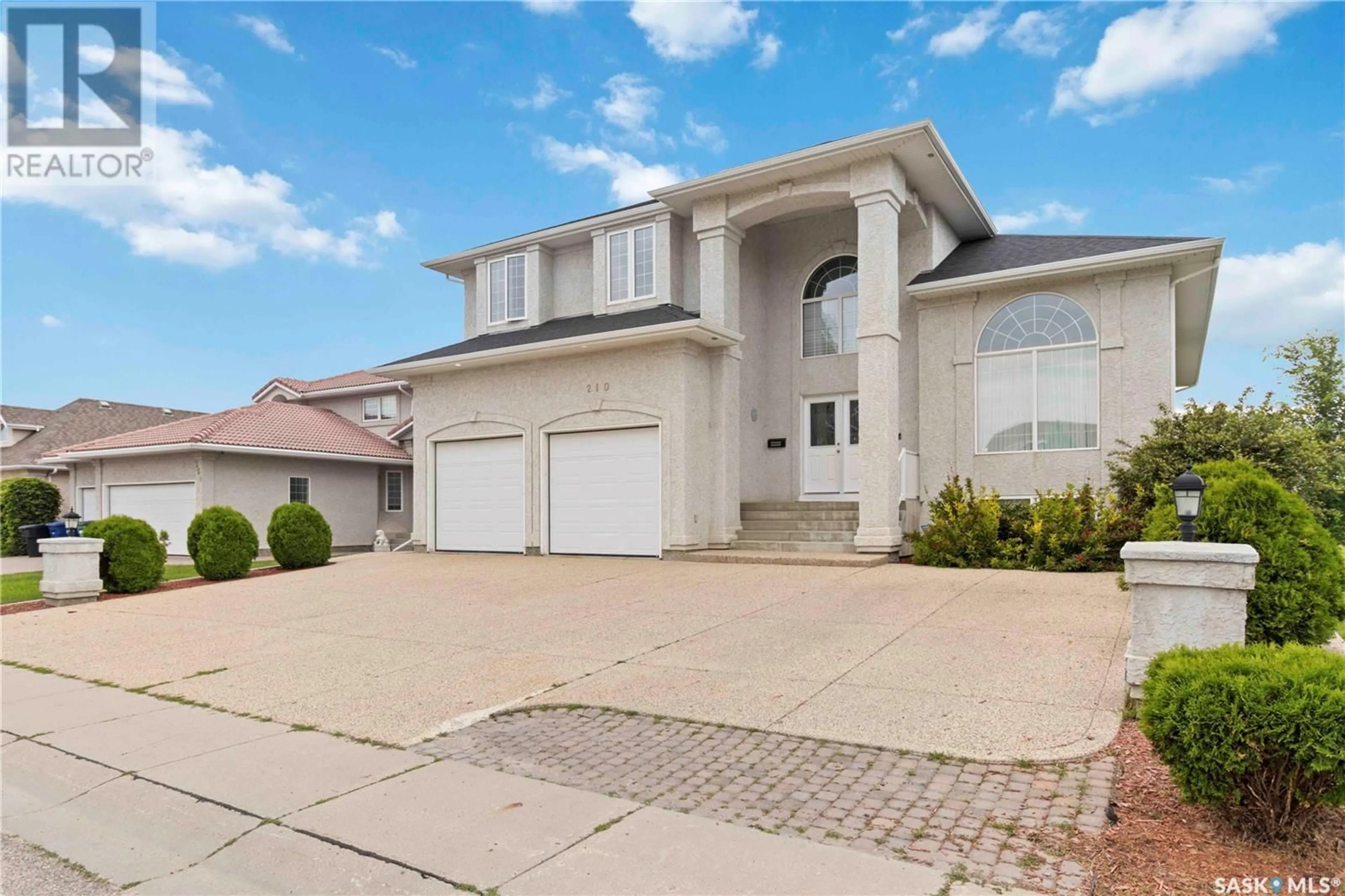 Home with vinyl exterior material, street for 210 BROOKHURST CRESCENT, Saskatoon Saskatchewan S7V1C5
