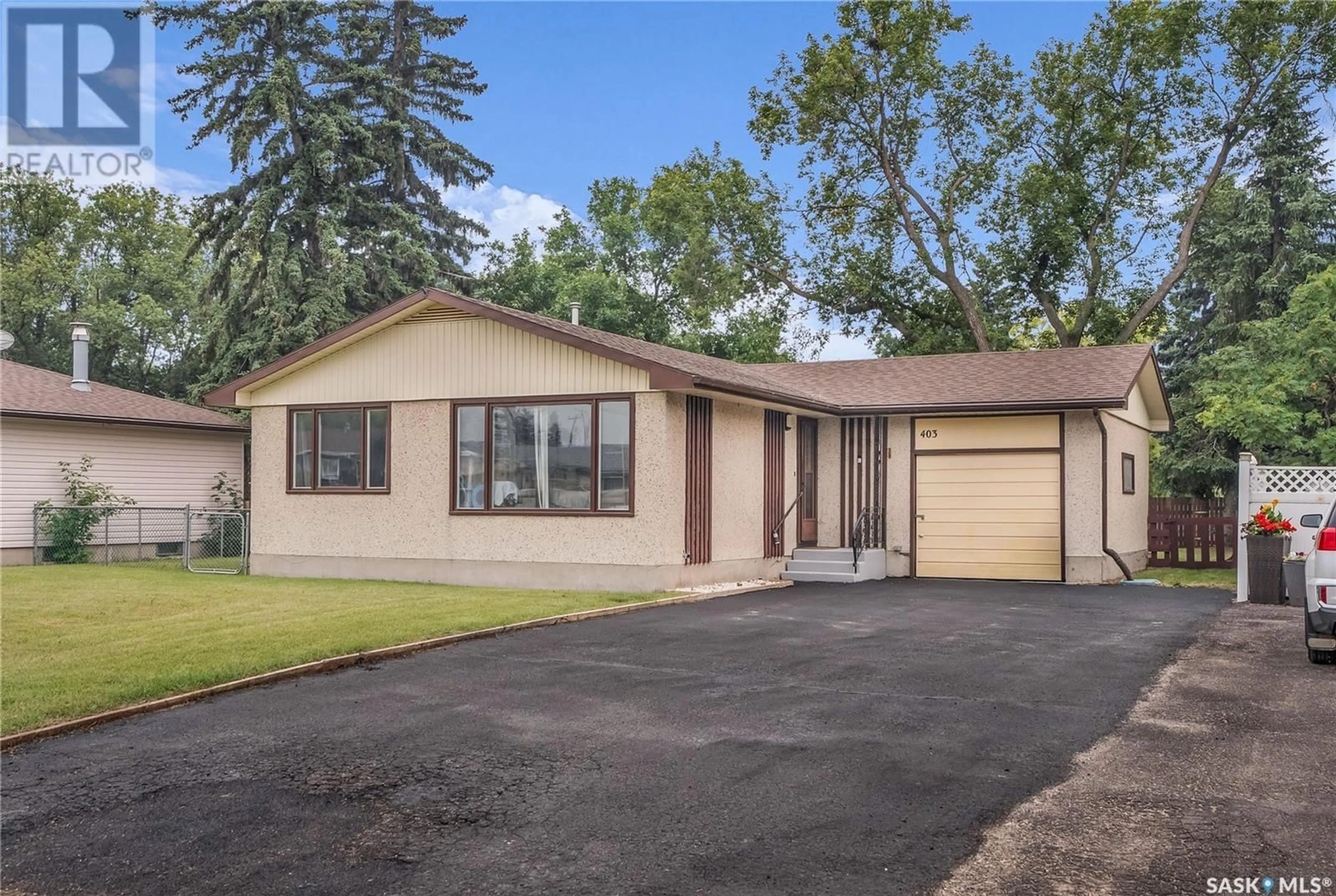 Home with vinyl exterior material, street for 403 5TH AVENUE, Watrous Saskatchewan S0K4T0