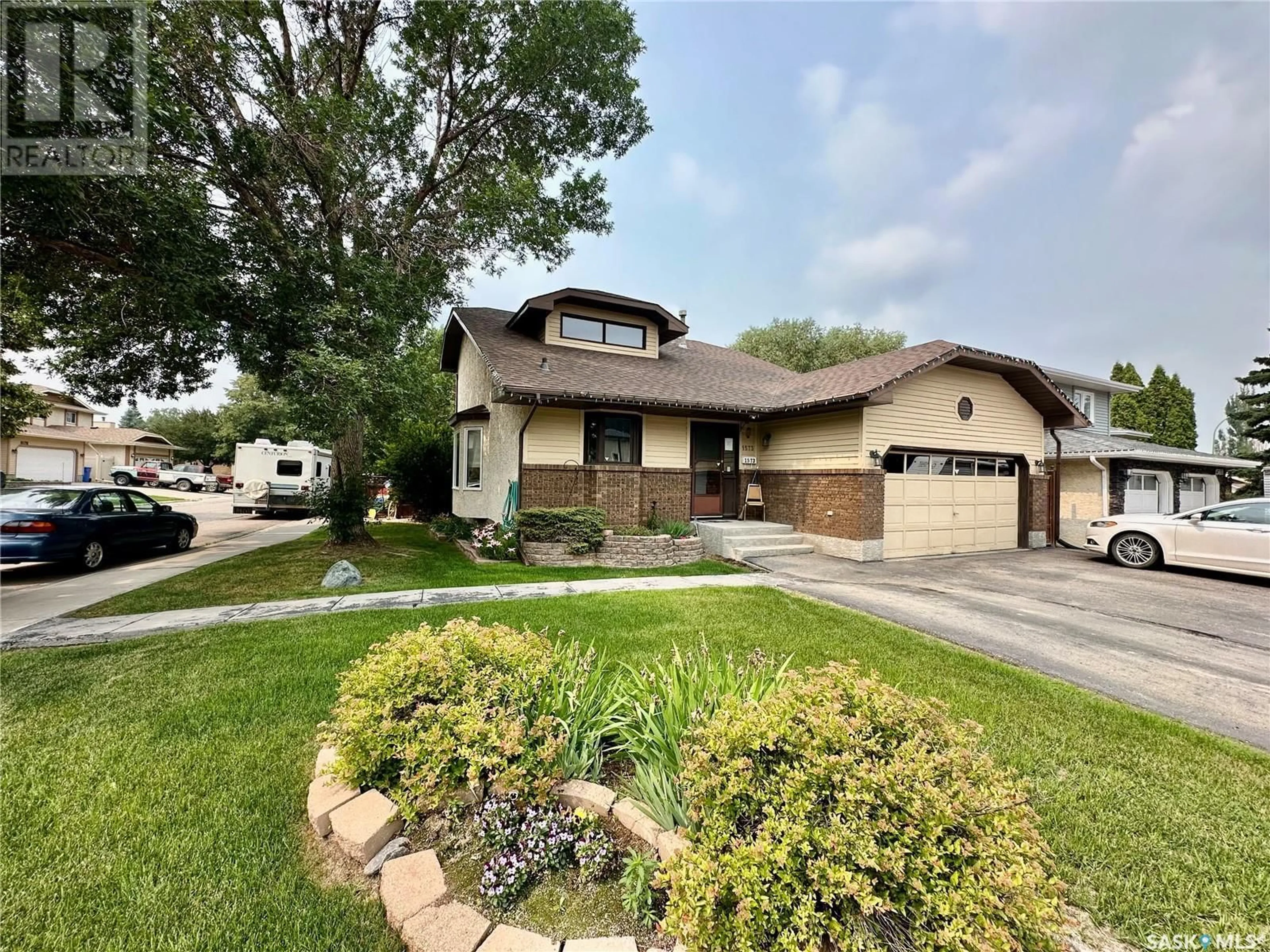 Home with vinyl exterior material, street for 1573 DEVONSHIRE DRIVE, Regina Saskatchewan S4X4A1