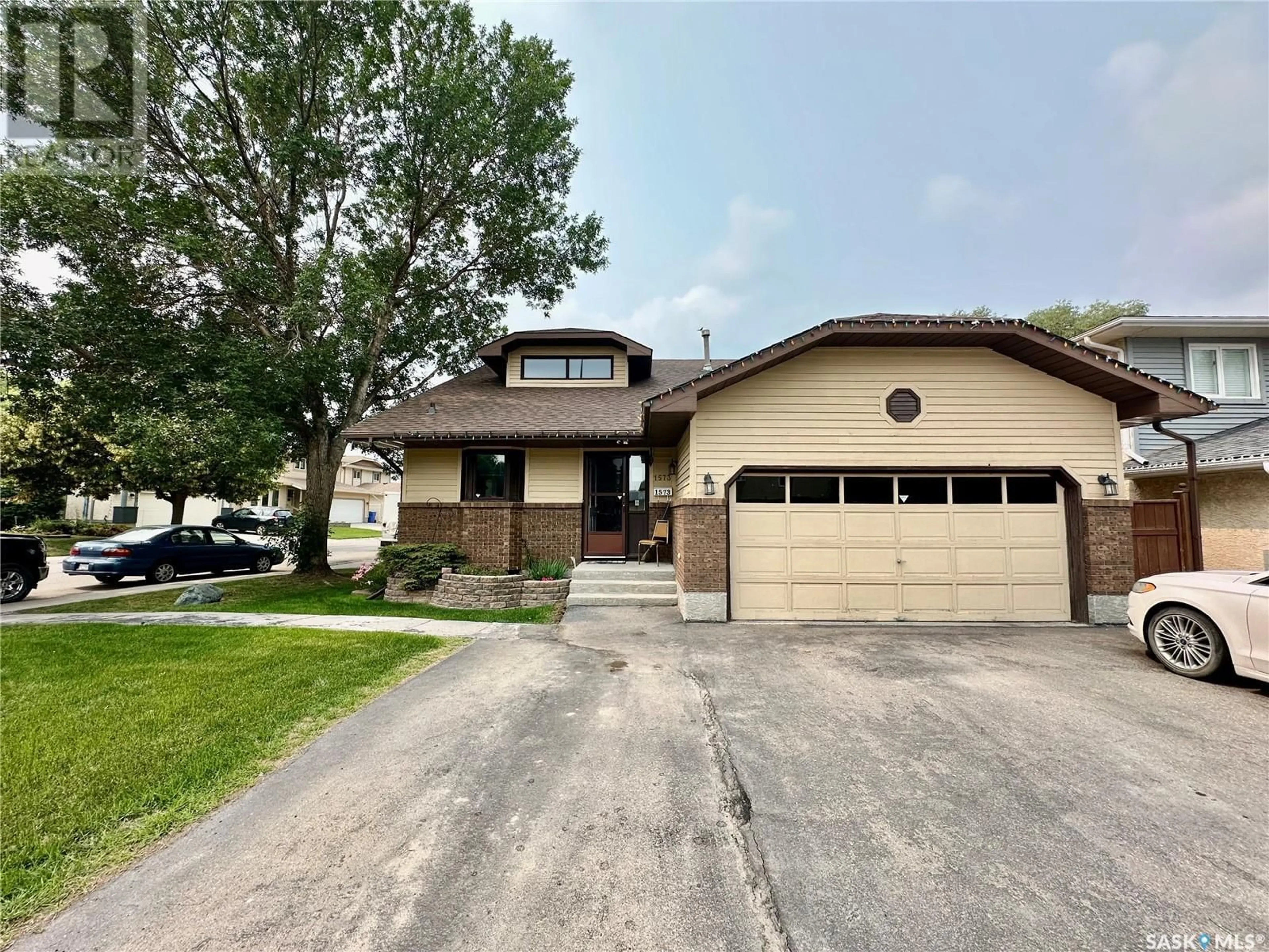 Home with brick exterior material, street for 1573 DEVONSHIRE DRIVE, Regina Saskatchewan S4X4A1