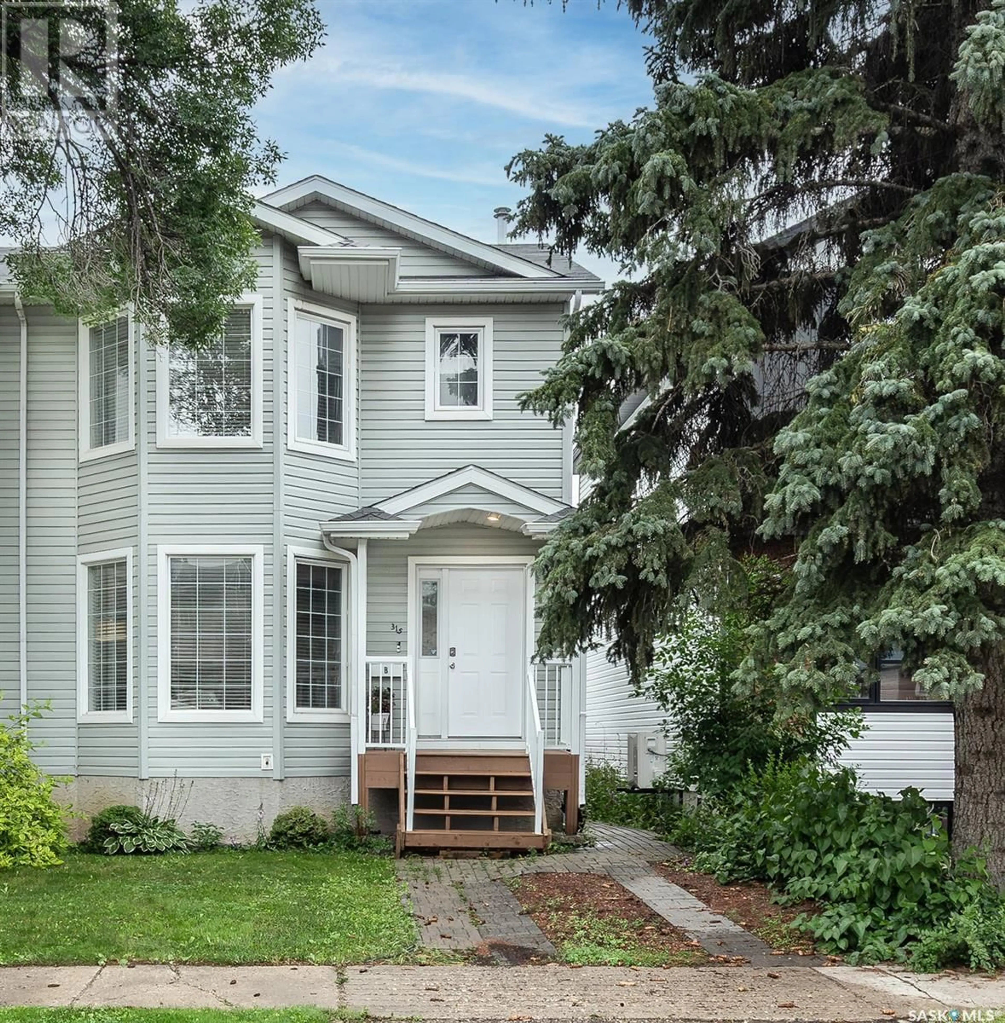 Home with vinyl exterior material, street for 315B 109TH STREET, Saskatoon Saskatchewan S7N1R6