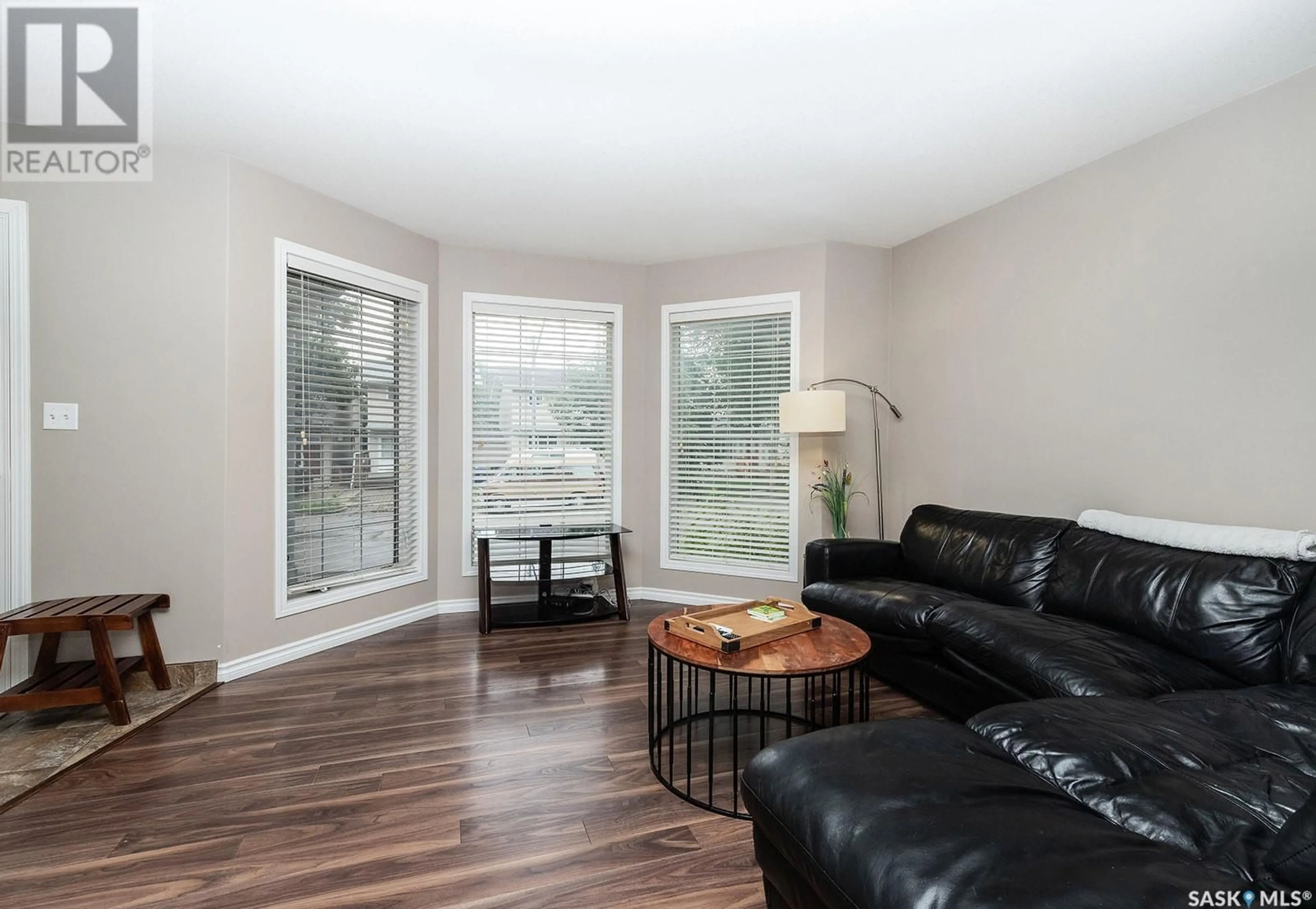 Living room with furniture, wood/laminate floor for 315B 109TH STREET, Saskatoon Saskatchewan S7N1R6