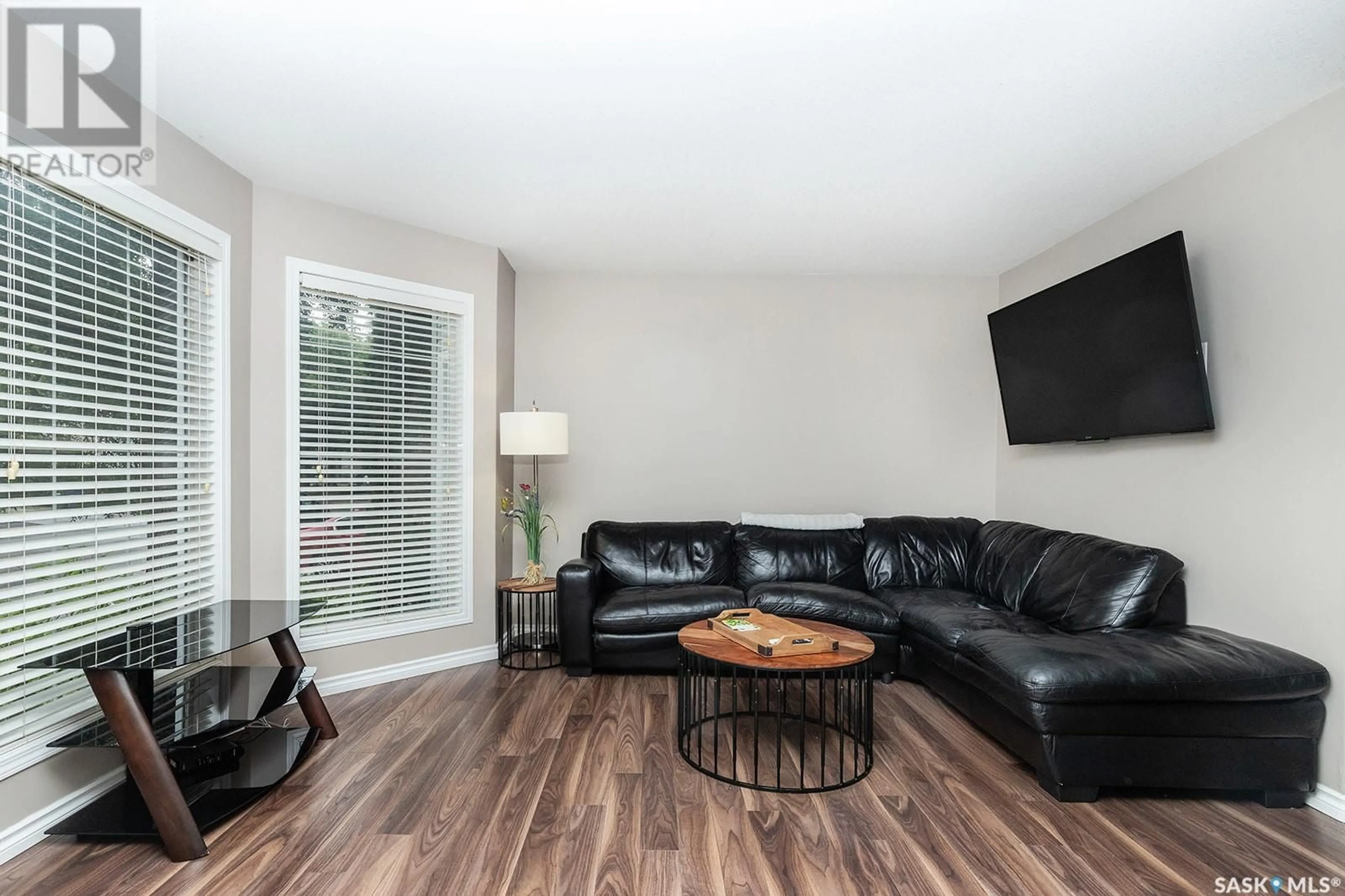 Living room with furniture, wood/laminate floor for 315B 109TH STREET, Saskatoon Saskatchewan S7N1R6