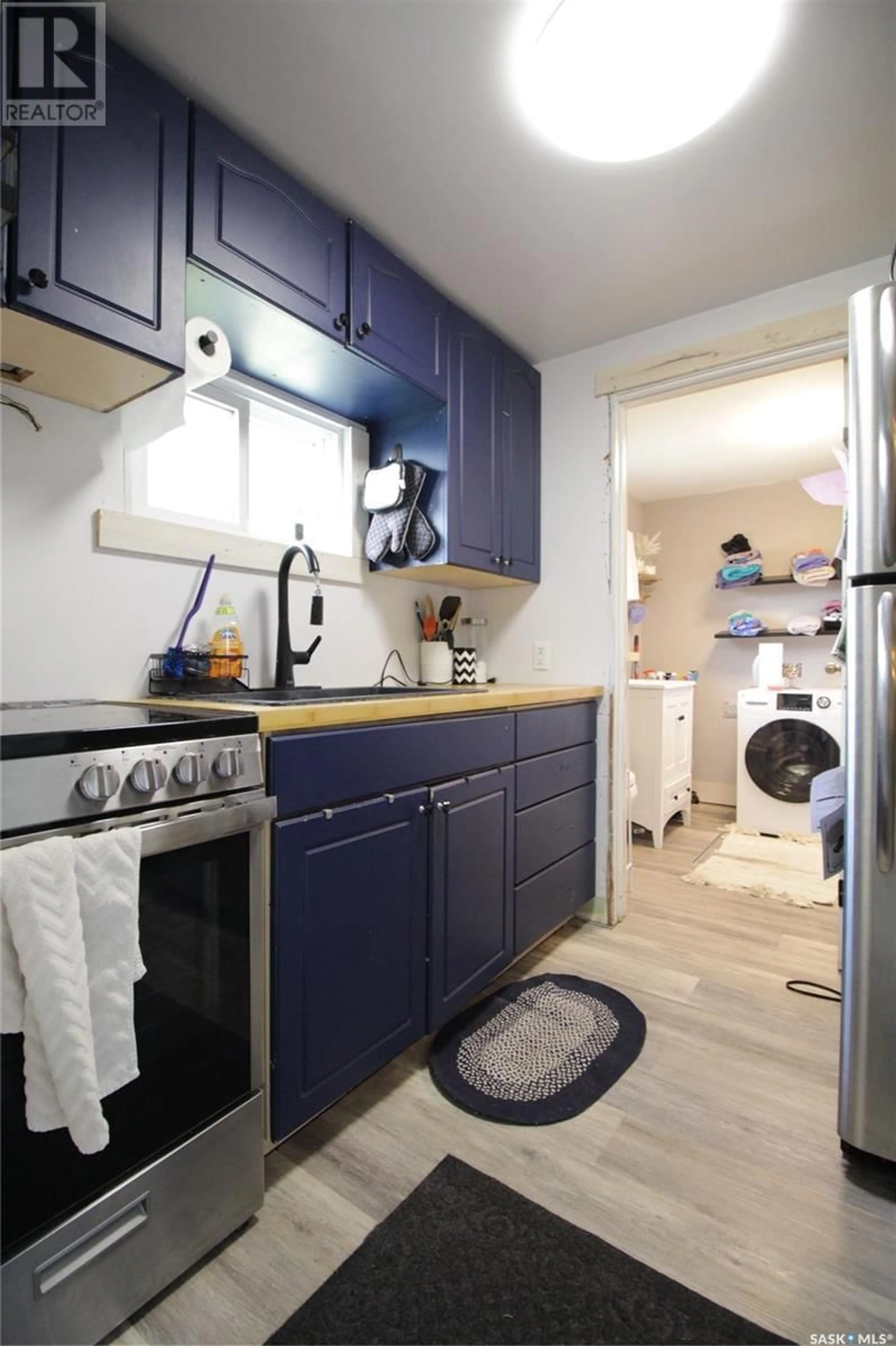 Kitchen with laundary machines, unknown for 307 BROADWAY AVENUE, Moosomin Saskatchewan S0G3N0
