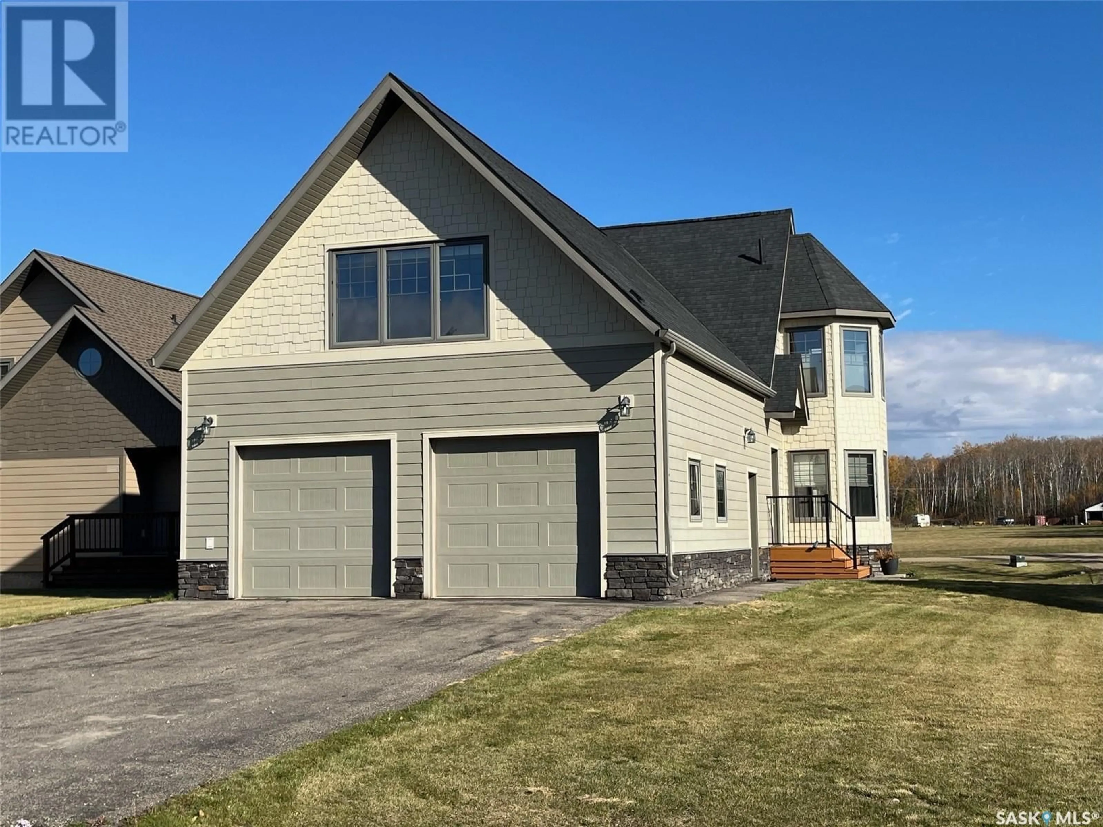 Home with vinyl exterior material, street for 4 NEIS ACCESS ROAD, Lakeland Rm No. 521 Saskatchewan S0J0N0