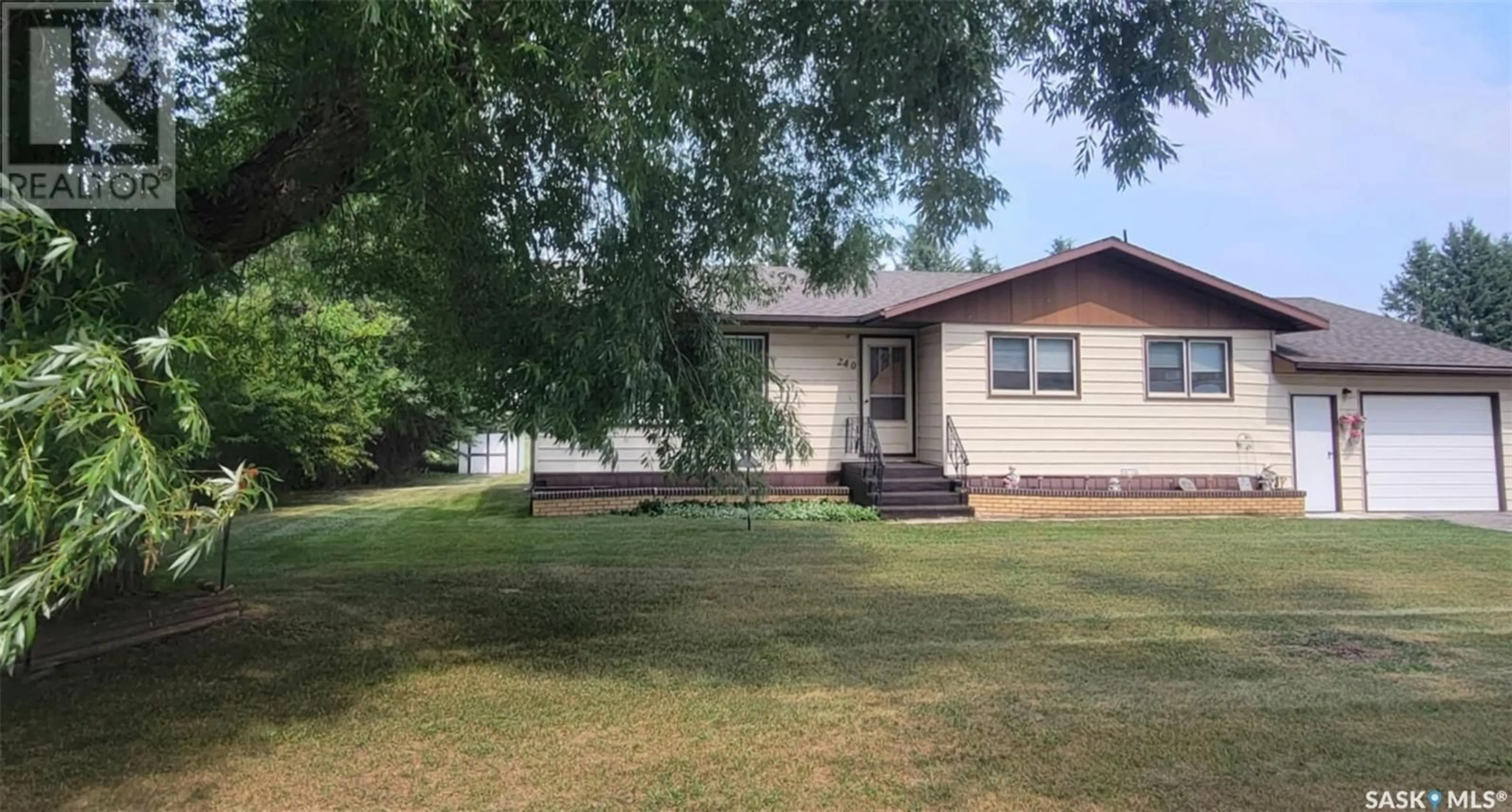 A pic from outside/outdoor area/front of a property/back of a property/a pic from drone, street for 240 2ND AVENUE, Preeceville Saskatchewan S0A3B0
