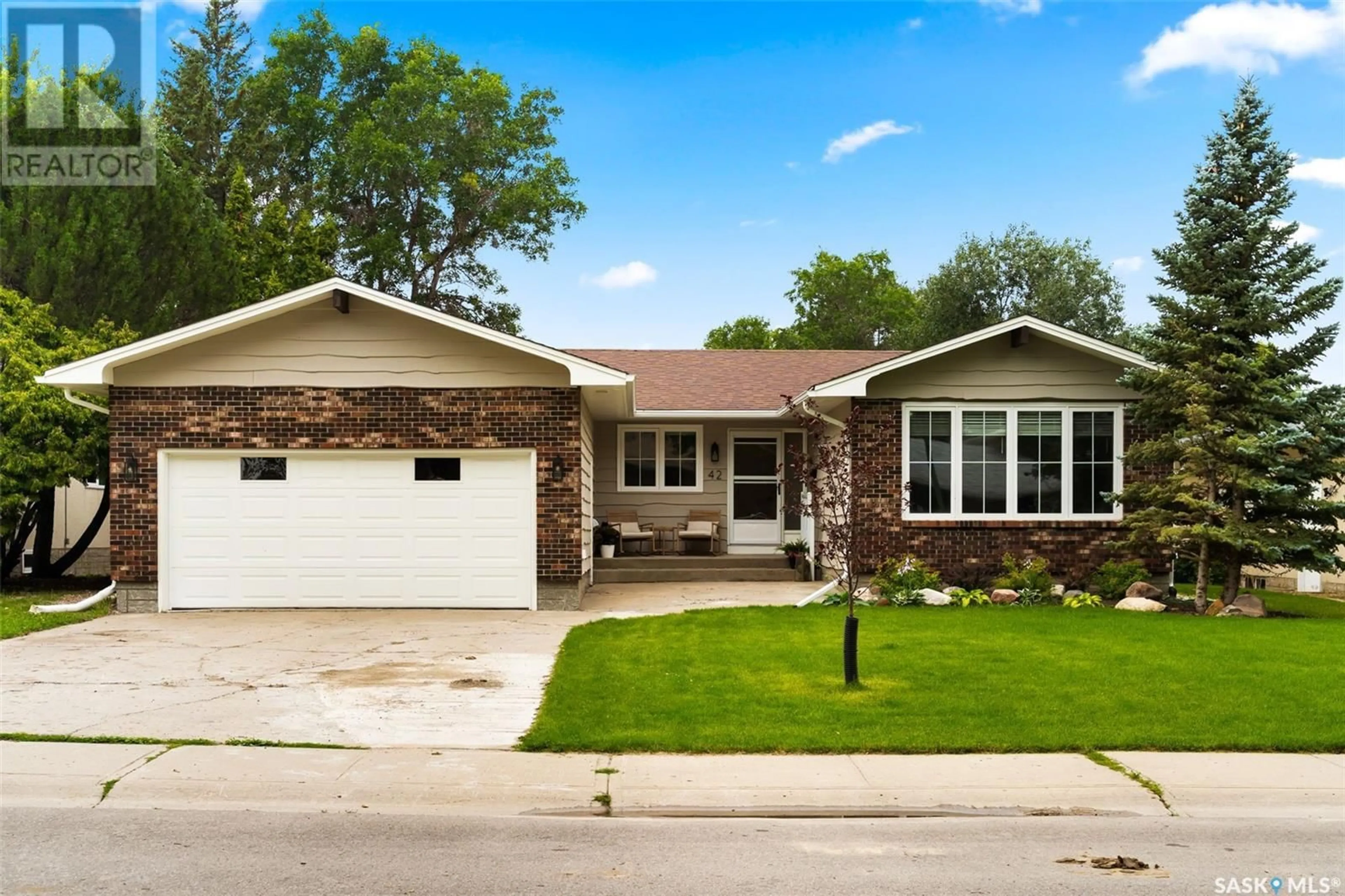 Home with brick exterior material, street for 42 POWELL PLACE, Regina Saskatchewan S4S6R9