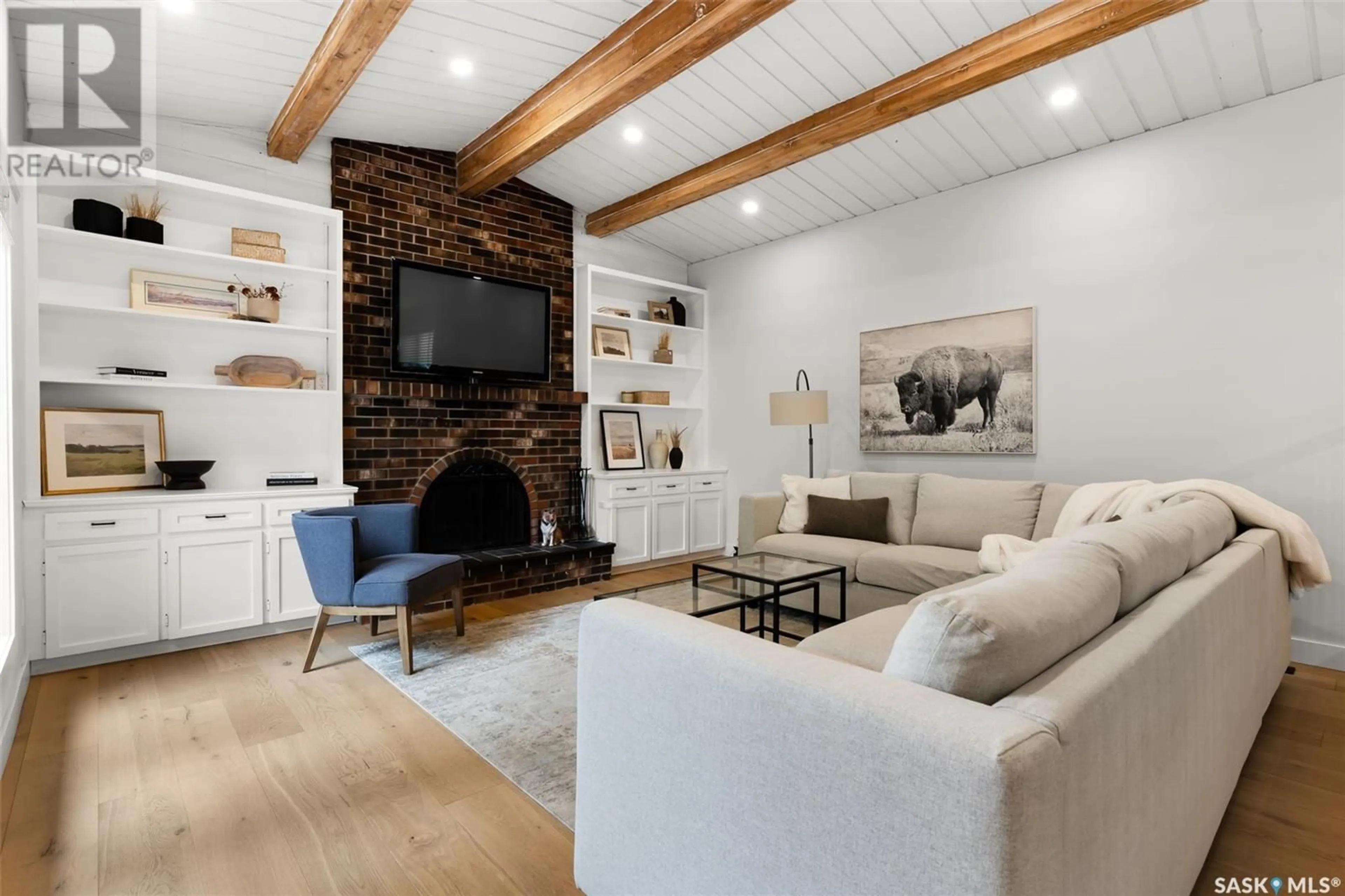 Living room with furniture, wood/laminate floor for 42 POWELL PLACE, Regina Saskatchewan S4S6R9