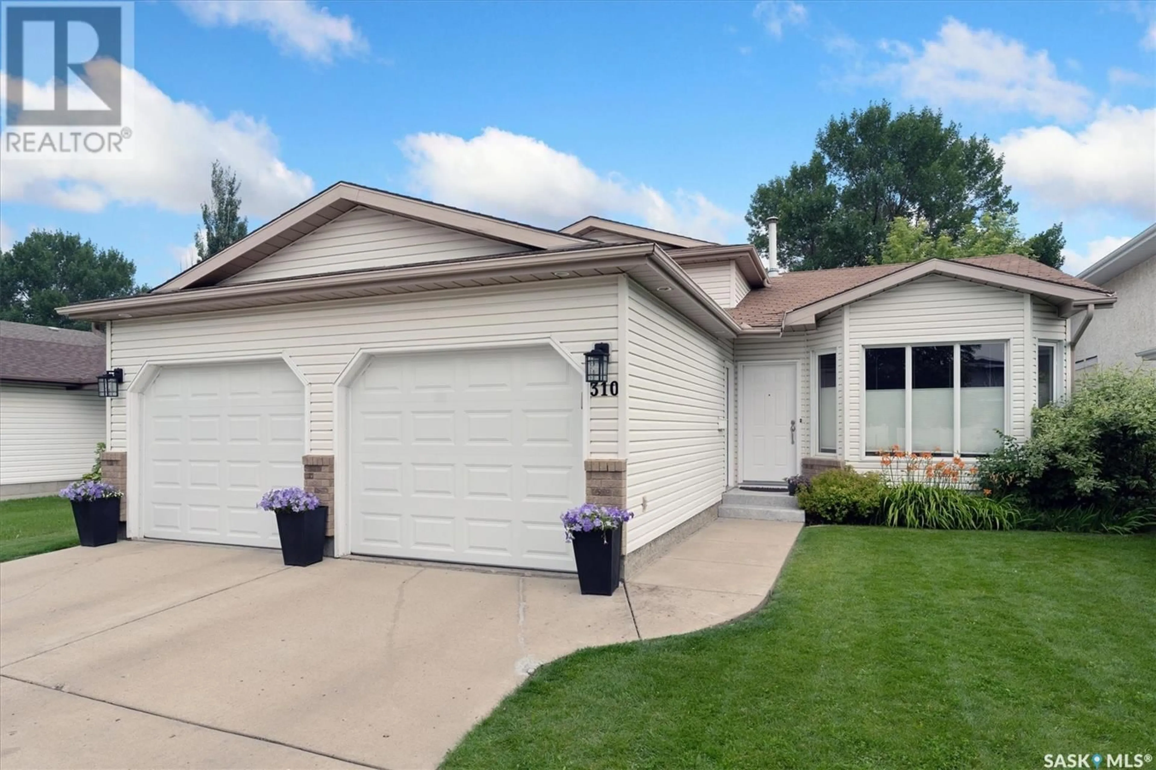 Home with vinyl exterior material, street for 310 COBEN CRESCENT, Saskatoon Saskatchewan S7S1B3