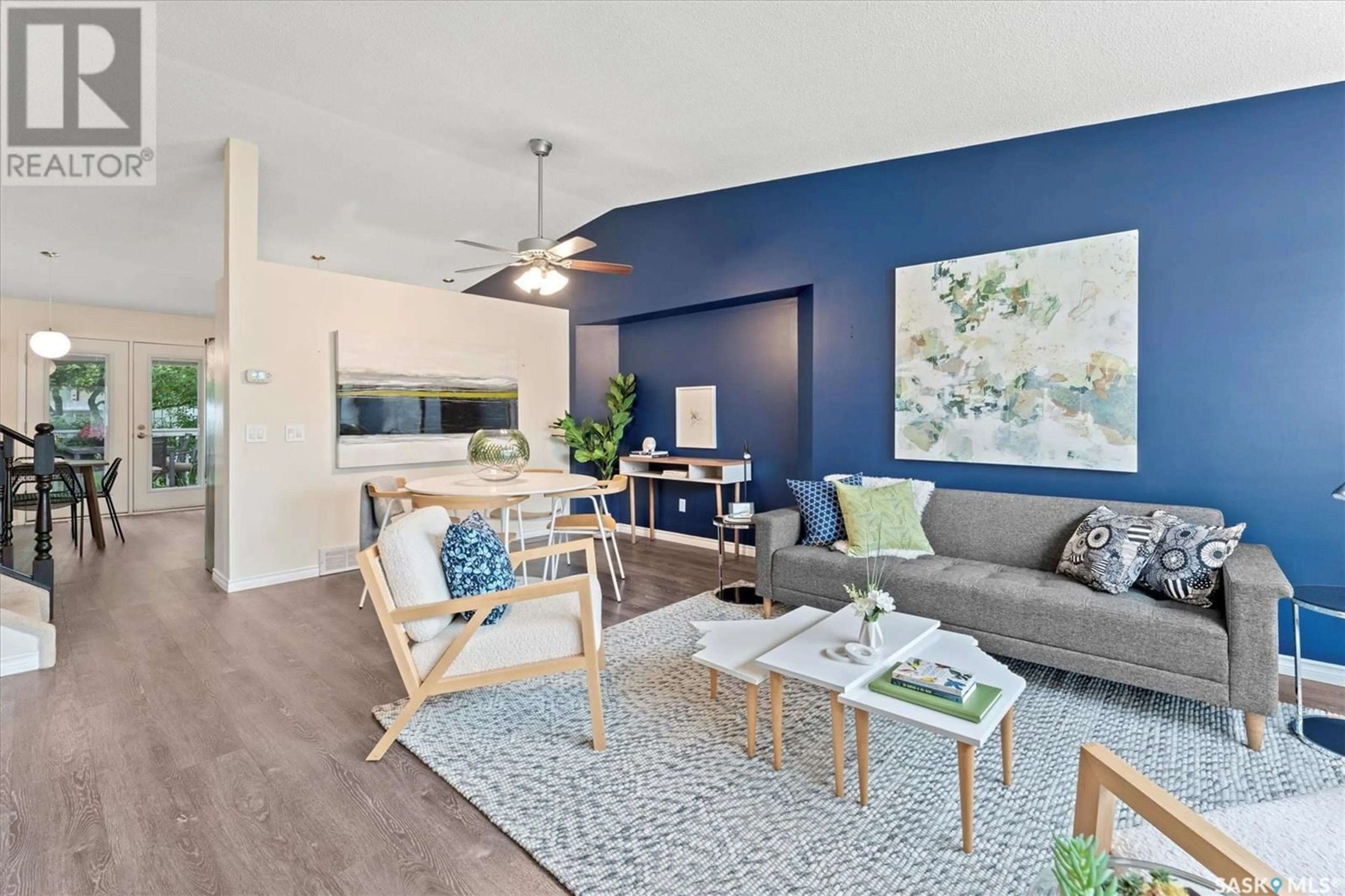 Living room with furniture, wood/laminate floor for 310 COBEN CRESCENT, Saskatoon Saskatchewan S7S1B3