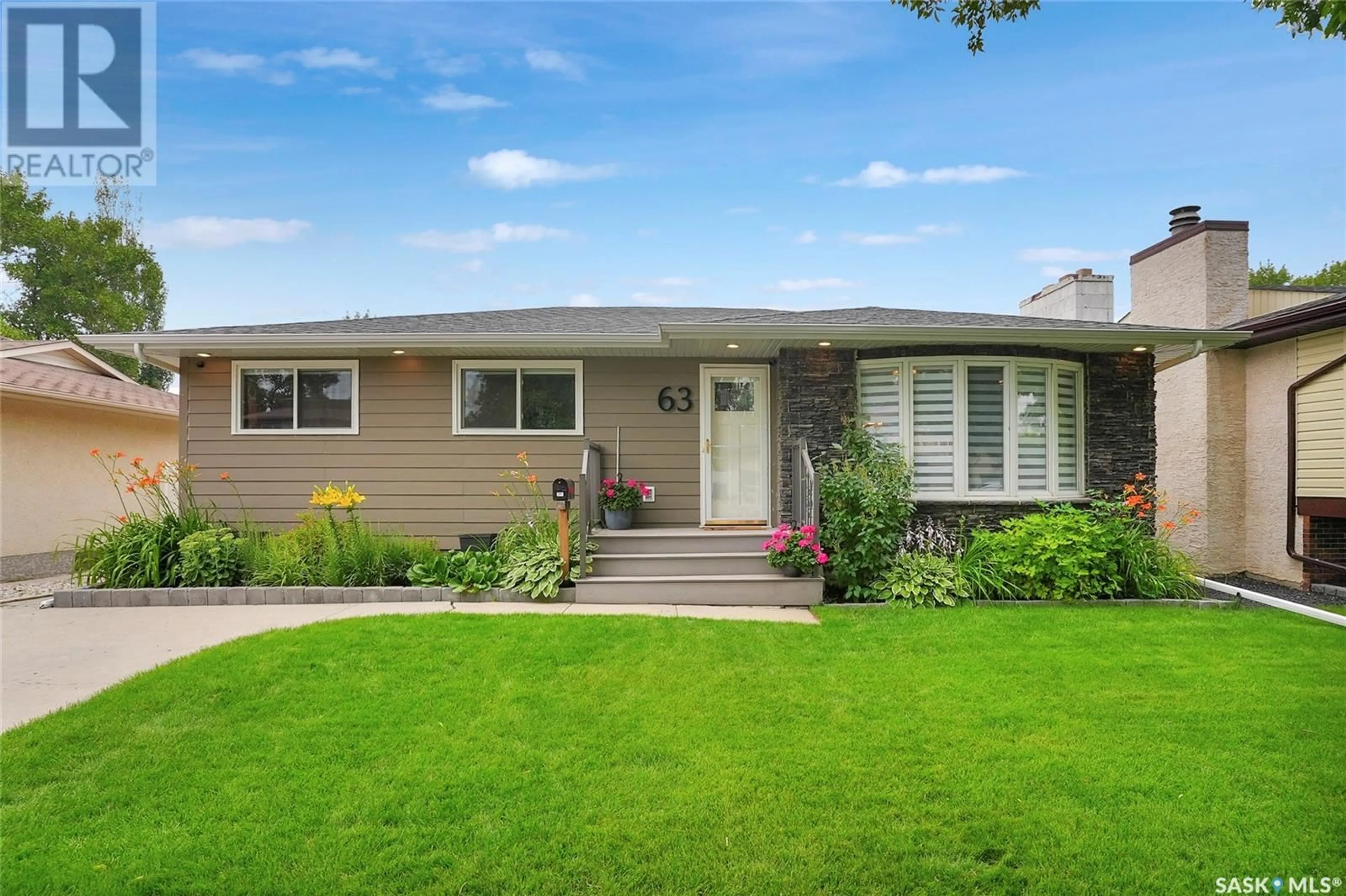 Home with vinyl exterior material, street for 63 WILLISTON DRIVE, Regina Saskatchewan S4X1C3