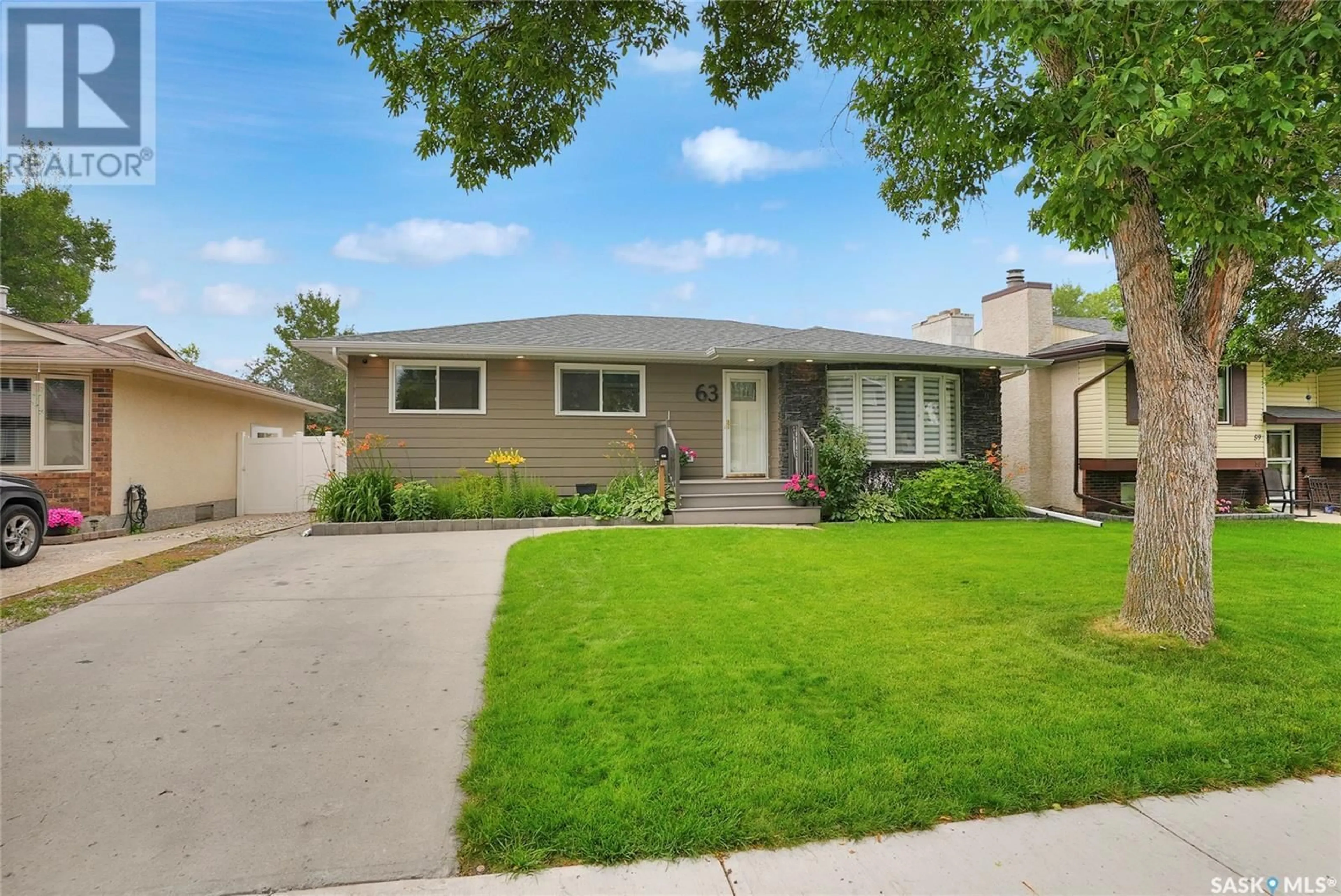 Home with vinyl exterior material, street for 63 WILLISTON DRIVE, Regina Saskatchewan S4X1C3