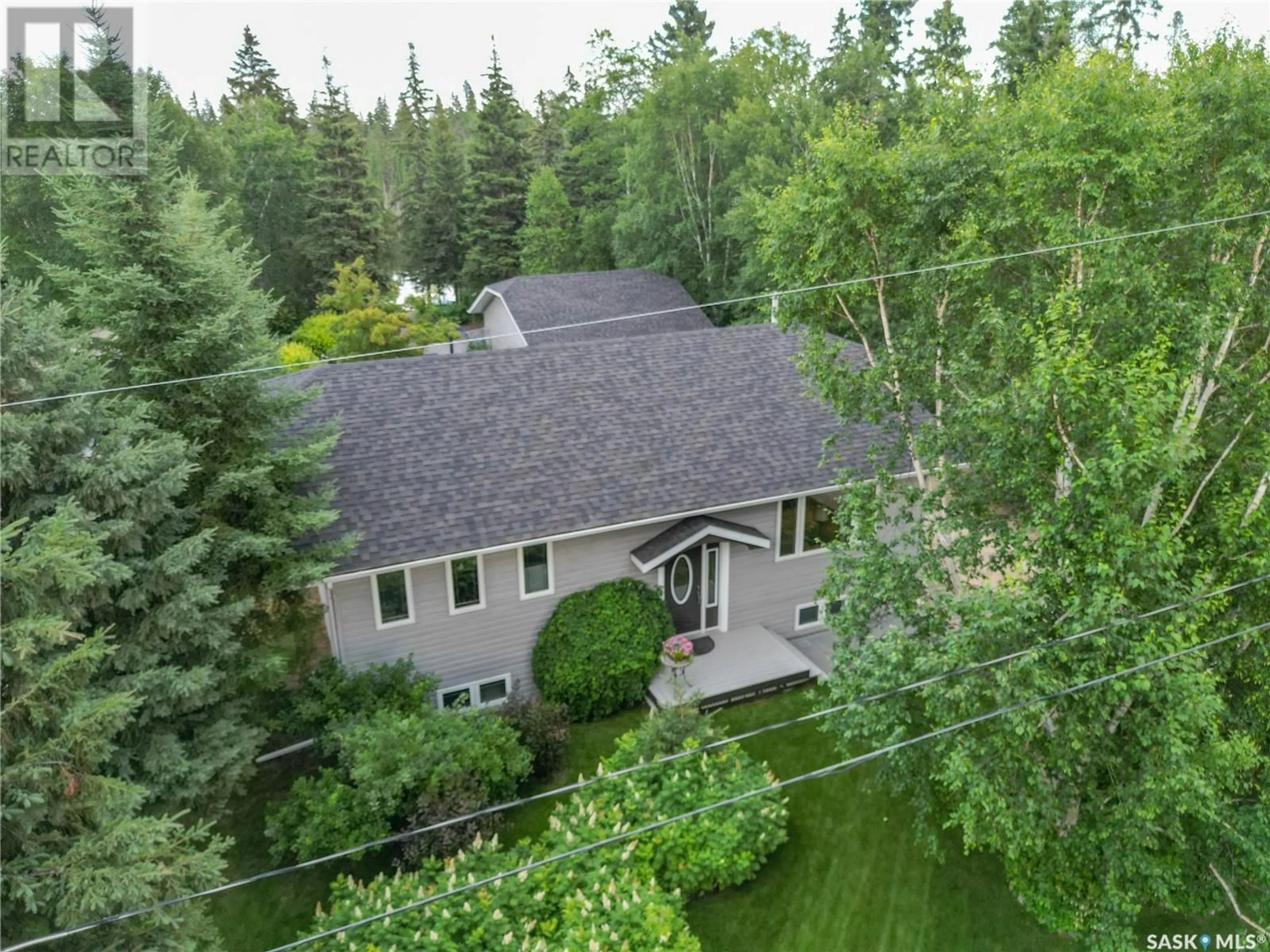 A pic from outside/outdoor area/front of a property/back of a property/a pic from drone, forest/trees view for 315 ILA AVENUE, Lakeland Rm No. 521 Saskatchewan S0J0N0