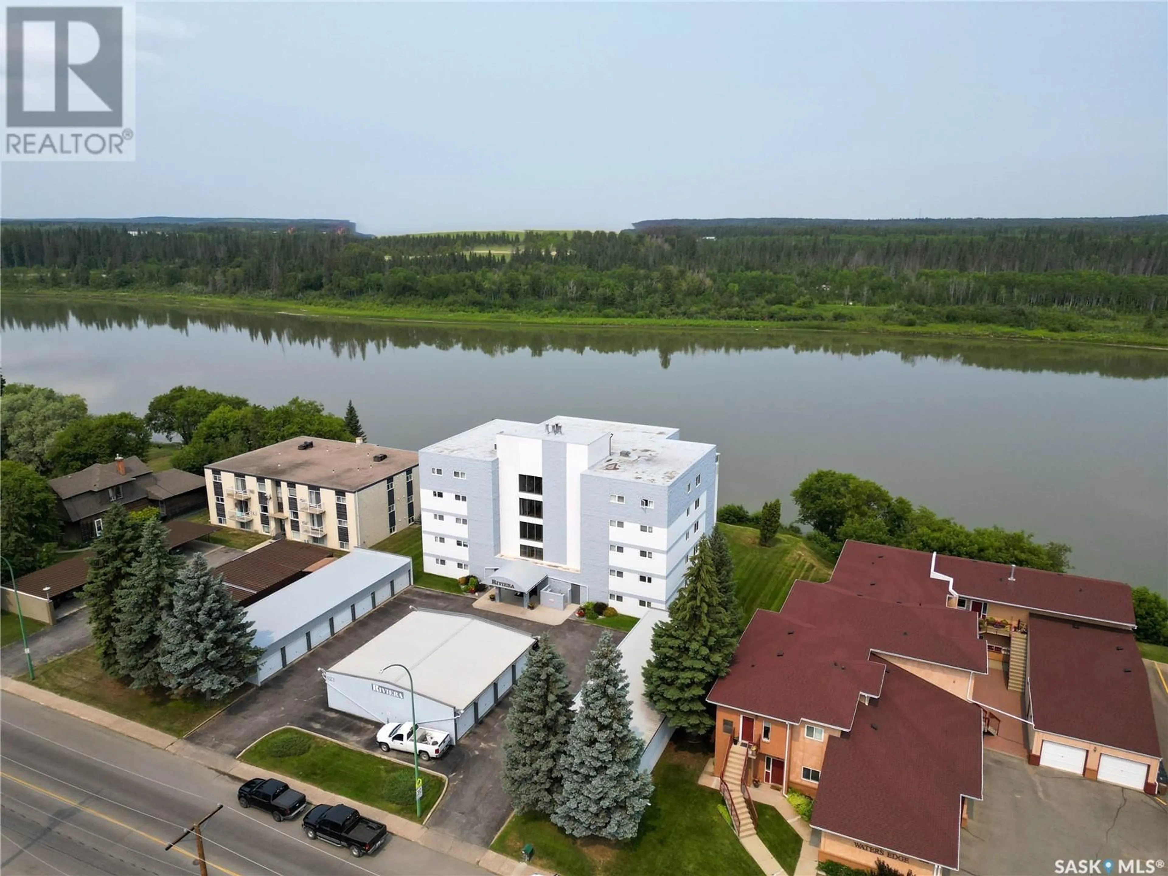 A pic from outside/outdoor area/front of a property/back of a property/a pic from drone, water/lake/river/ocean view for 1D - 516 RIVER STREET, Prince Albert Saskatchewan S6V0A6