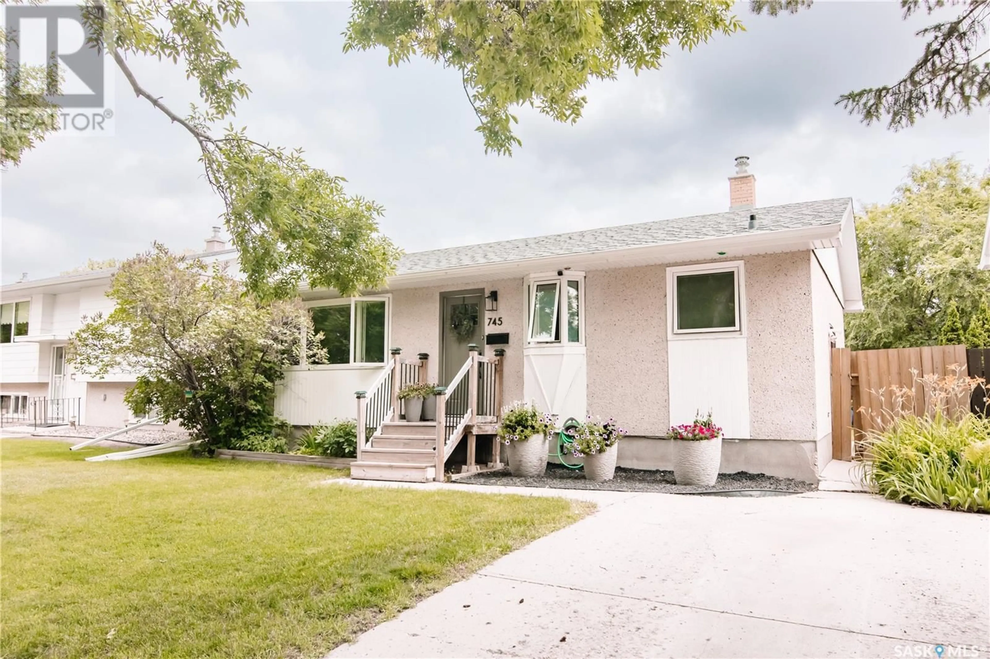 Home with vinyl exterior material, street for 745 SWEENEY STREET, Regina Saskatchewan S4T6H7