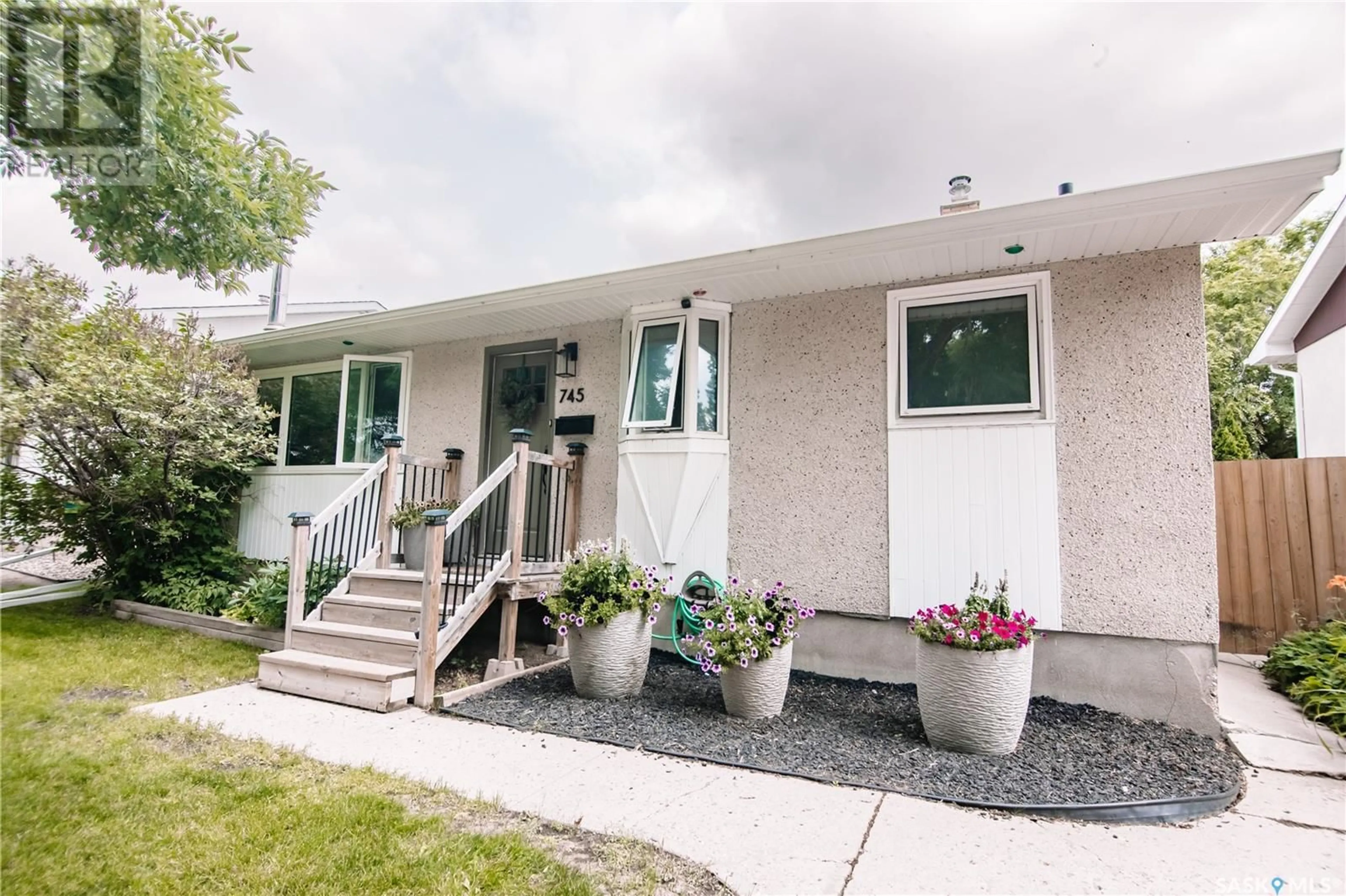 Home with vinyl exterior material, street for 745 SWEENEY STREET, Regina Saskatchewan S4T6H7