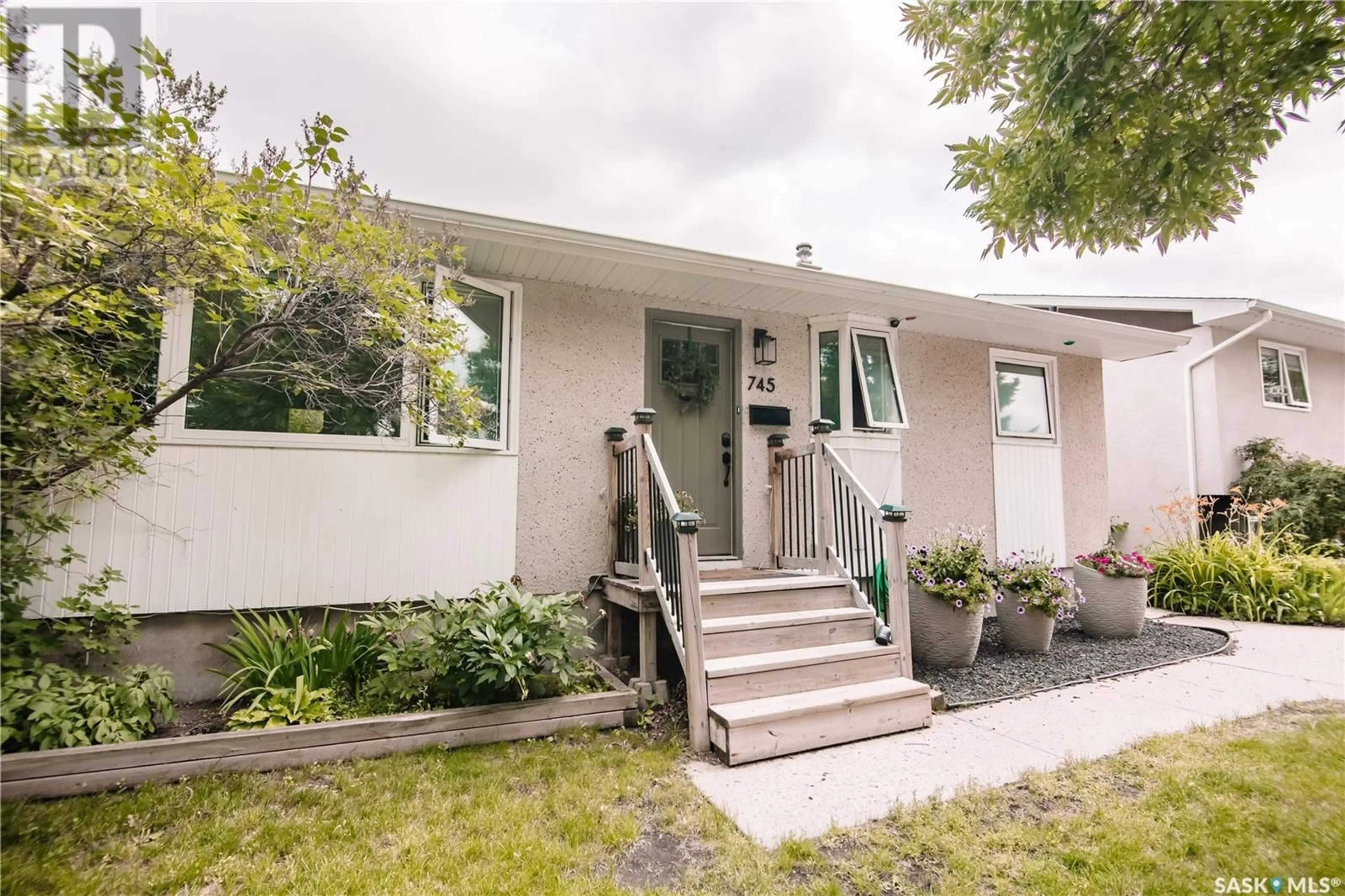 Home with vinyl exterior material, street for 745 SWEENEY STREET, Regina Saskatchewan S4T6H7