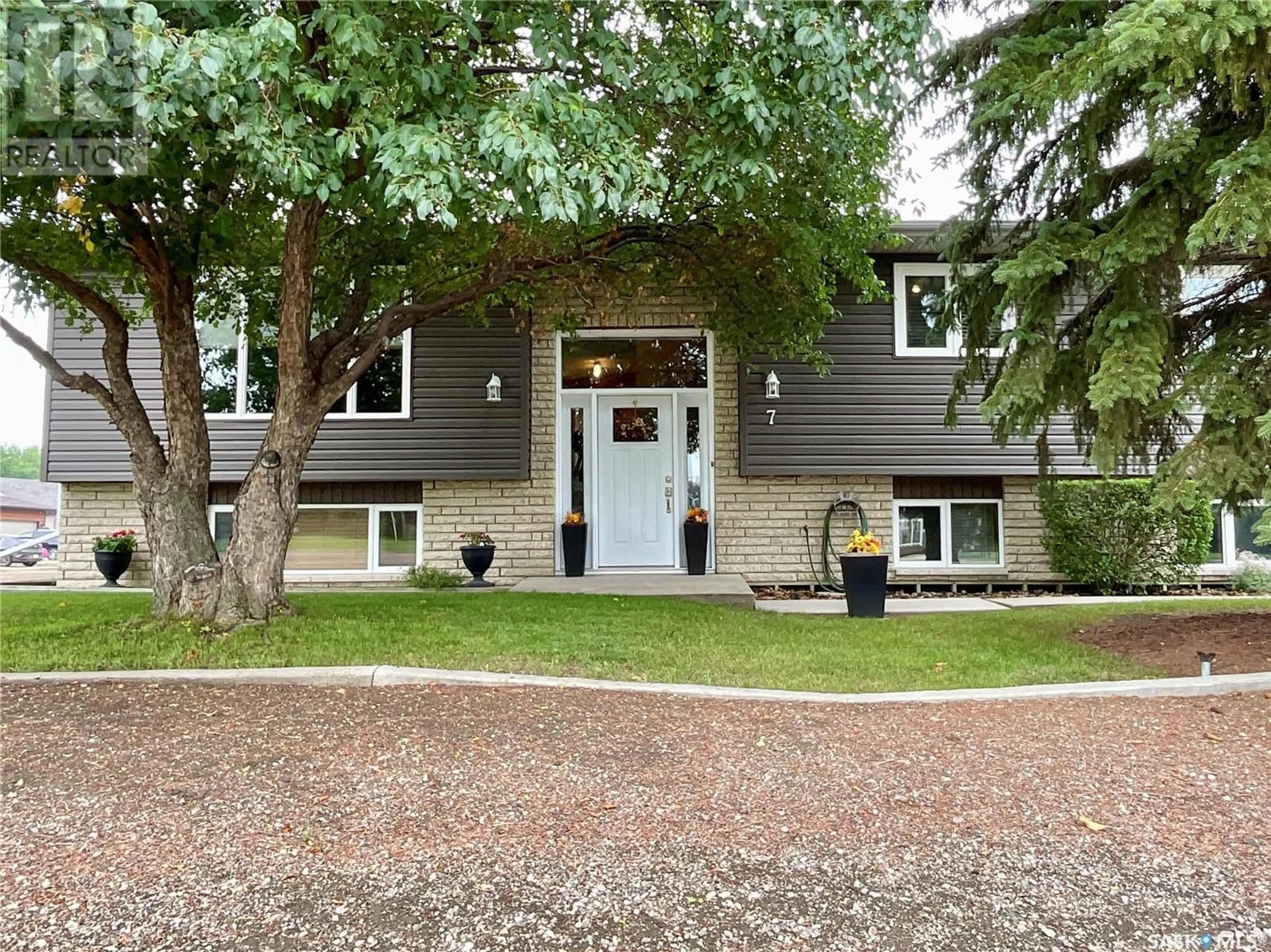 Home with brick exterior material, street for 7 HARVEST BAY, Grand Coulee Saskatchewan S4M0A3