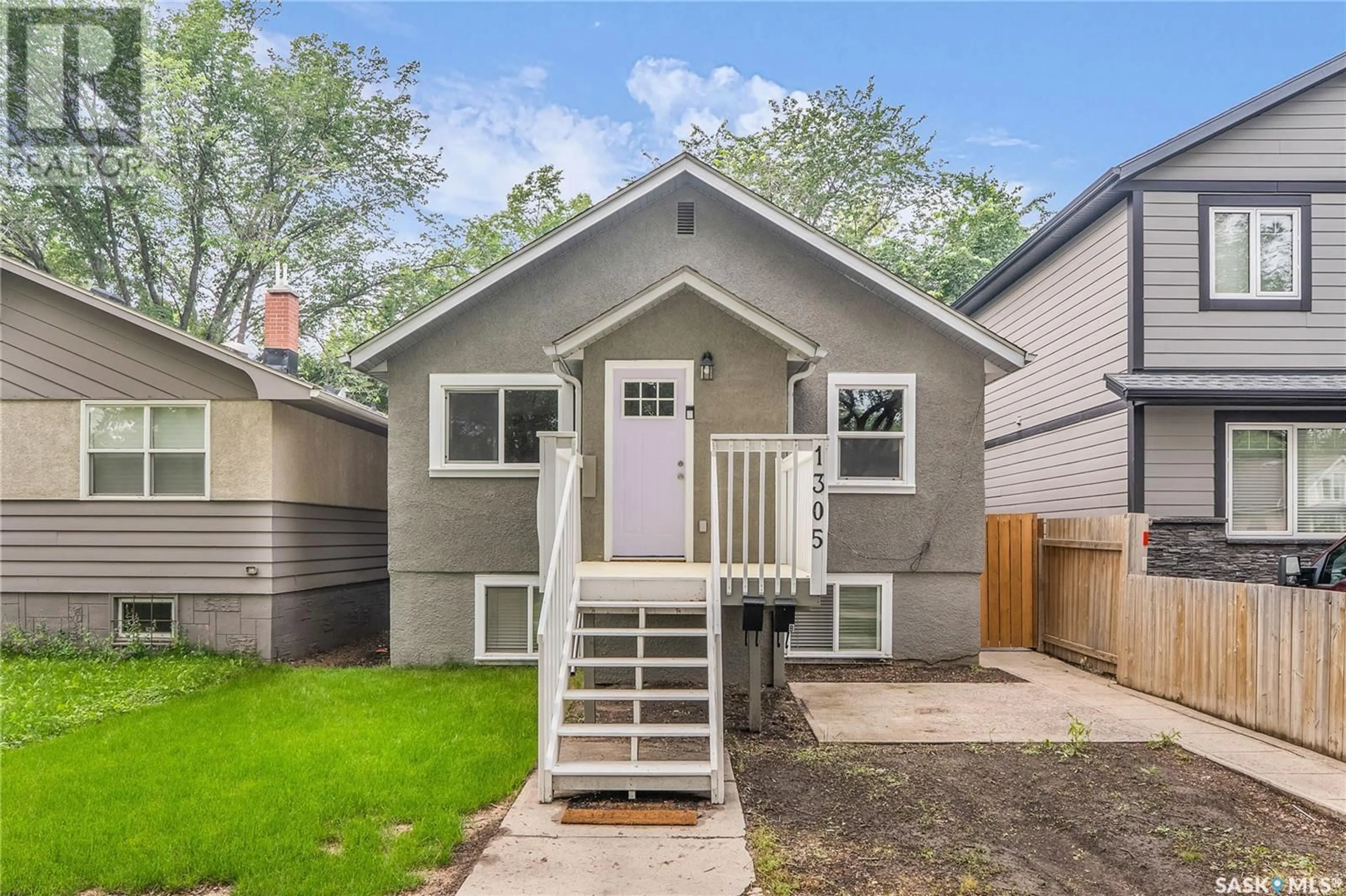 Home with vinyl exterior material, street for 1305 D AVENUE, Saskatoon Saskatchewan S7L1P2