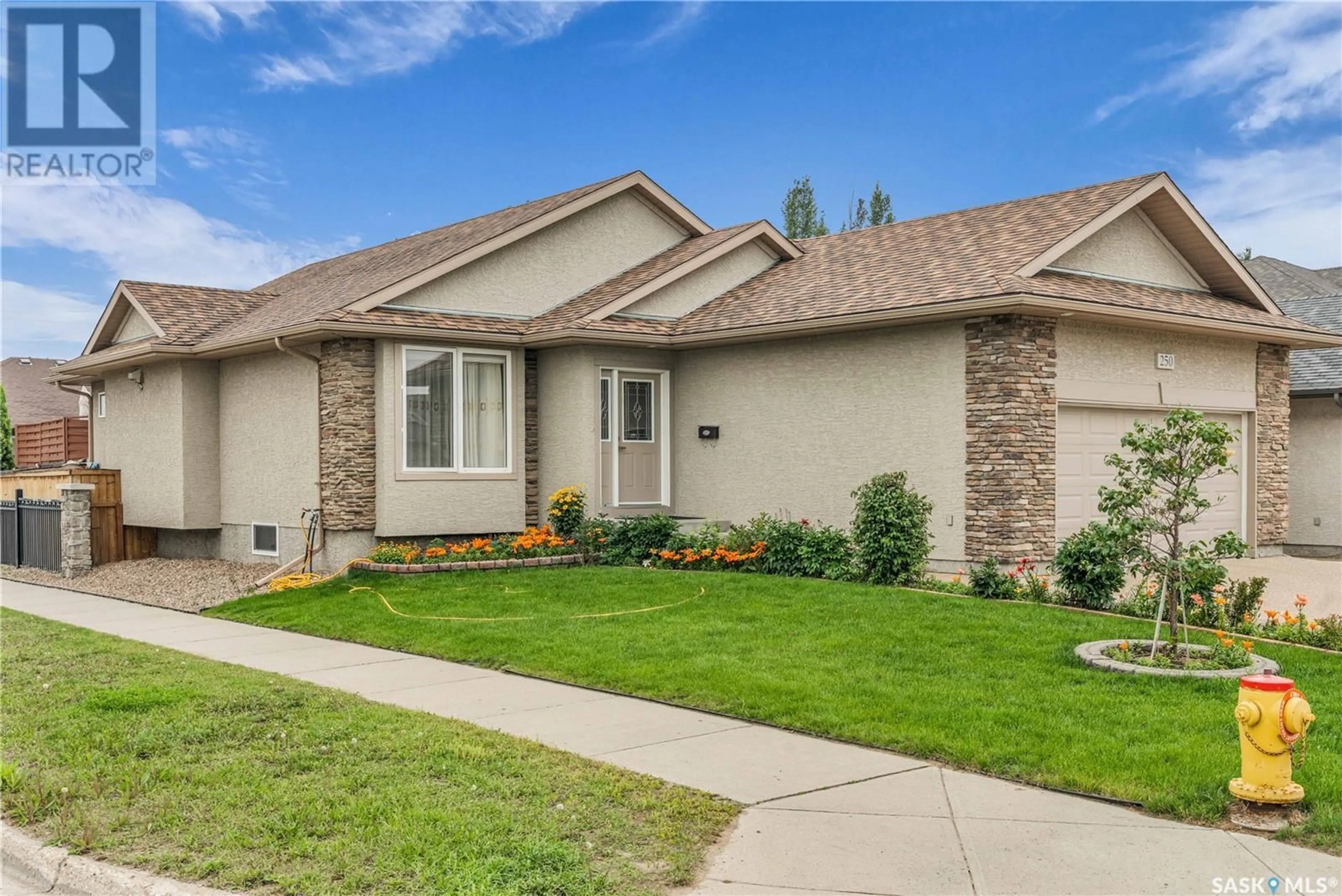Home with vinyl exterior material, street for 250 ROBERTSON COVE, Saskatoon Saskatchewan S7T0E6