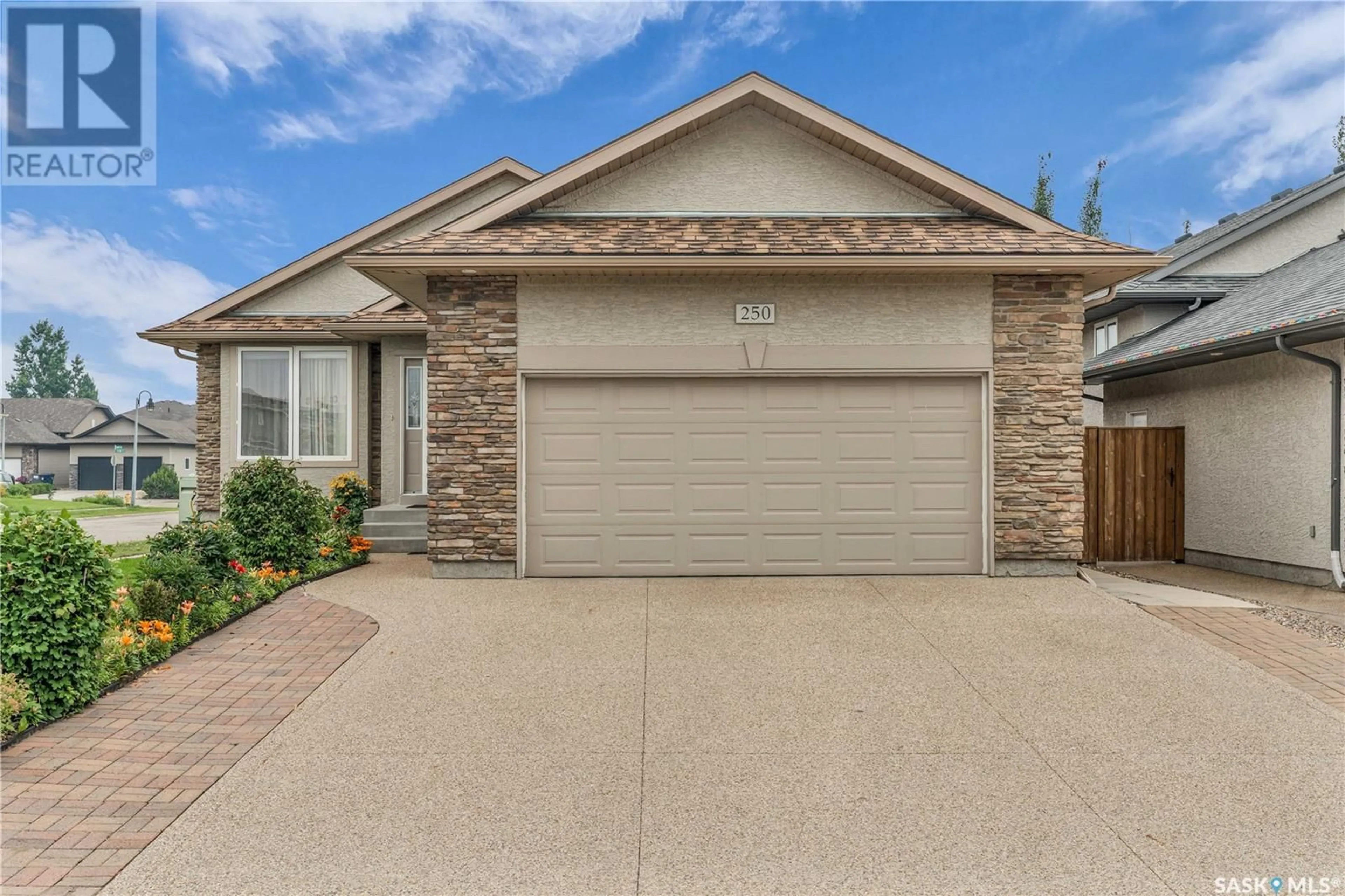 Home with brick exterior material, street for 250 ROBERTSON COVE, Saskatoon Saskatchewan S7T0E6