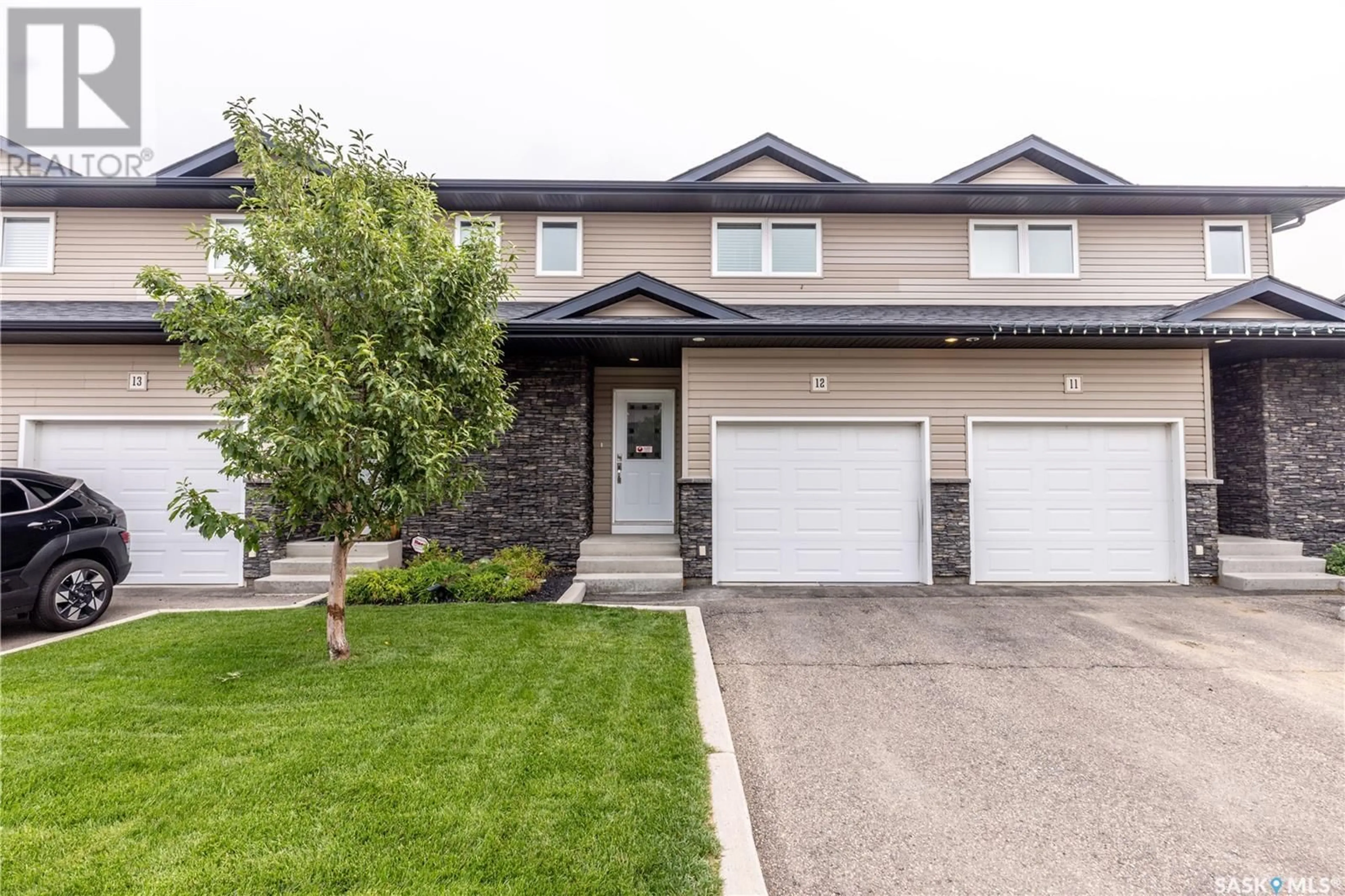Home with vinyl exterior material, street for 12 365 DAWSON CRESCENT, Saskatoon Saskatchewan S7R0L6