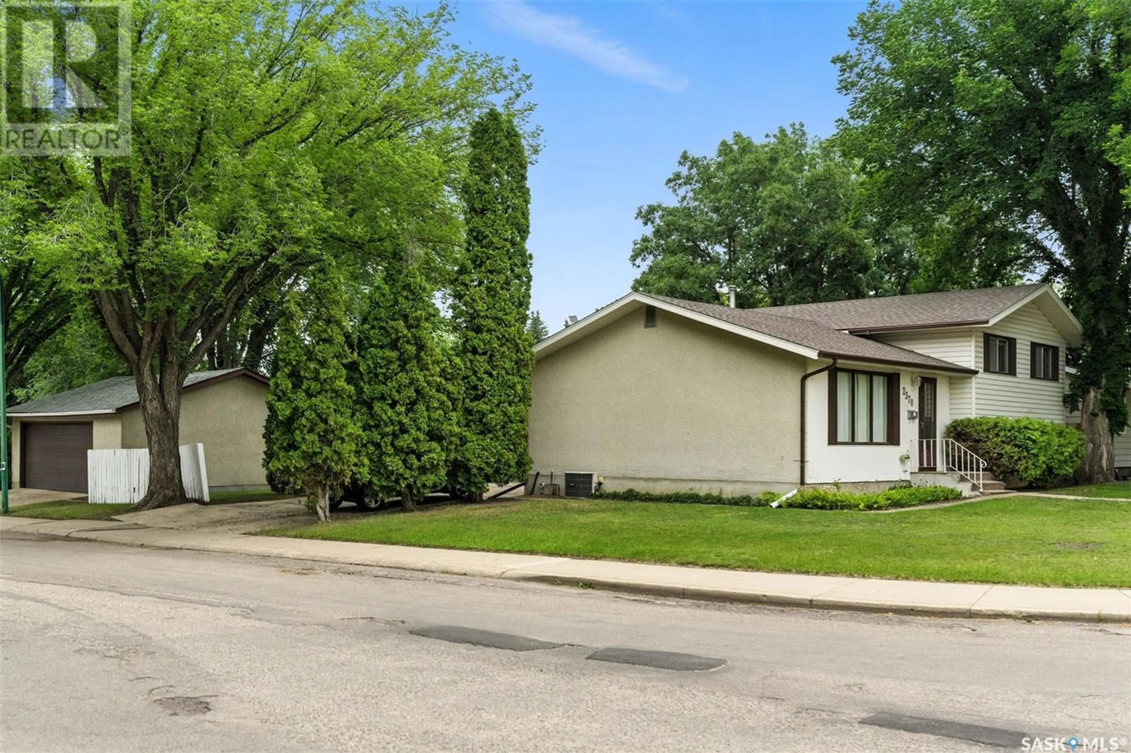 Home with vinyl exterior material, street for 2370 EASTHILL, Saskatoon Saskatchewan S7J3E5