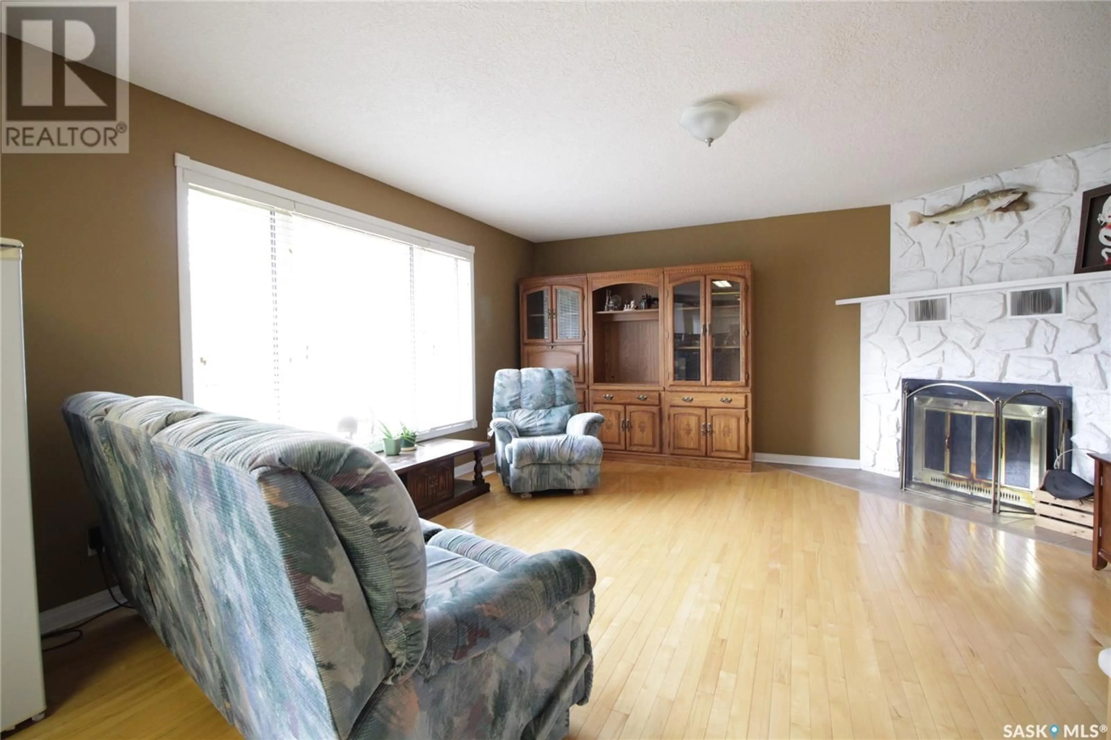 Living room with furniture, wood/laminate floor for 311 PELLY STREET, Rocanville Saskatchewan S0A3L0