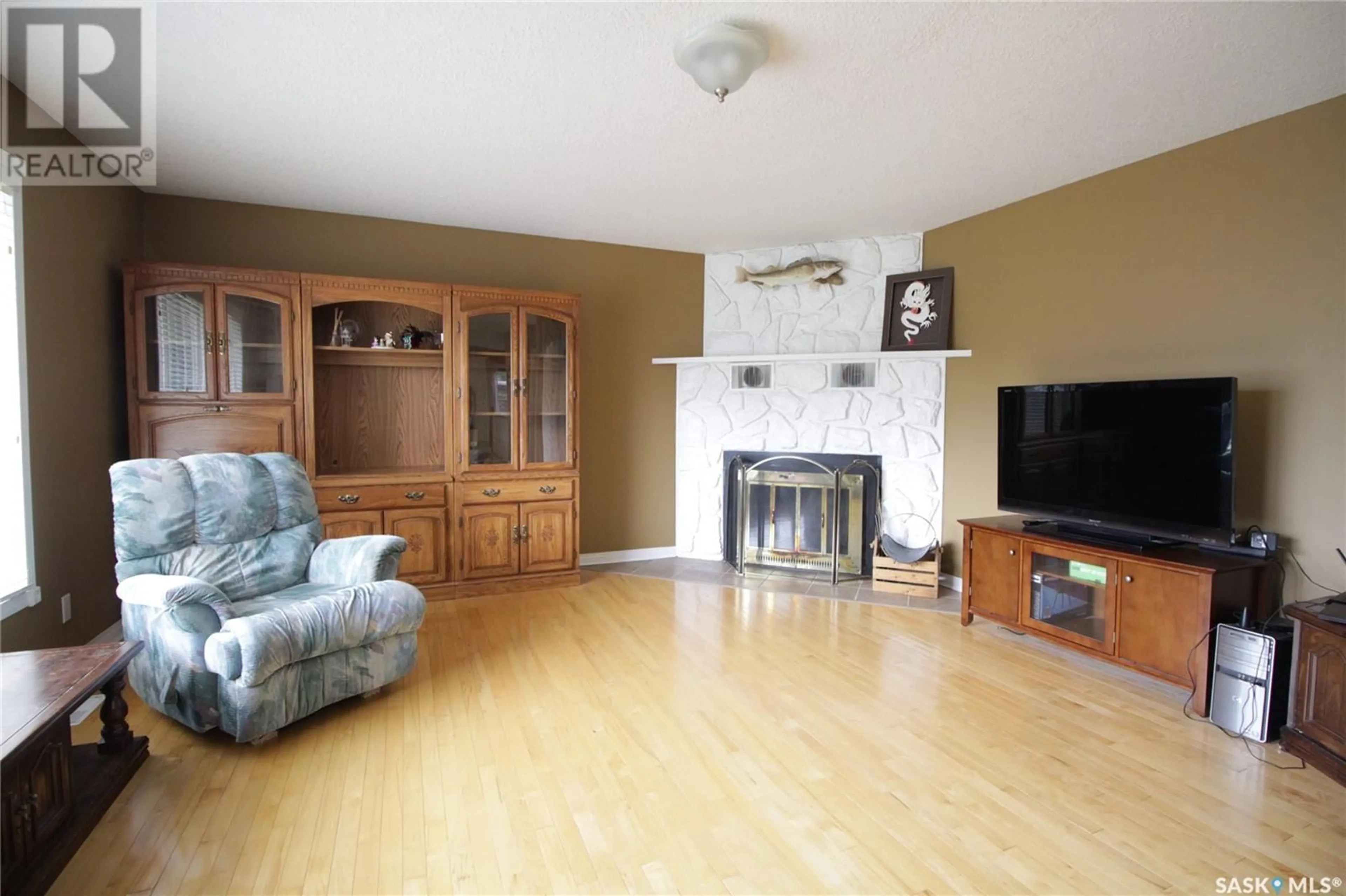 Living room with furniture, wood/laminate floor for 311 PELLY STREET, Rocanville Saskatchewan S0A3L0