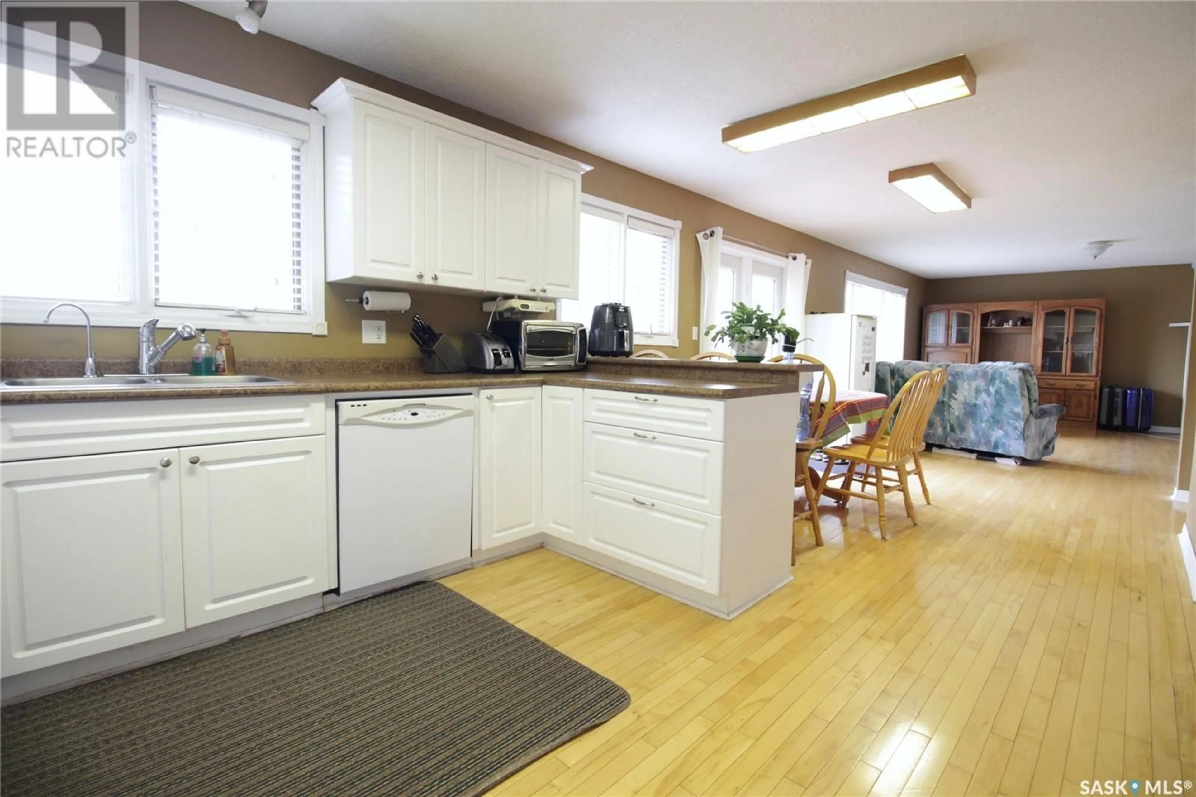 Open concept kitchen, wood/laminate floor for 311 PELLY STREET, Rocanville Saskatchewan S0A3L0