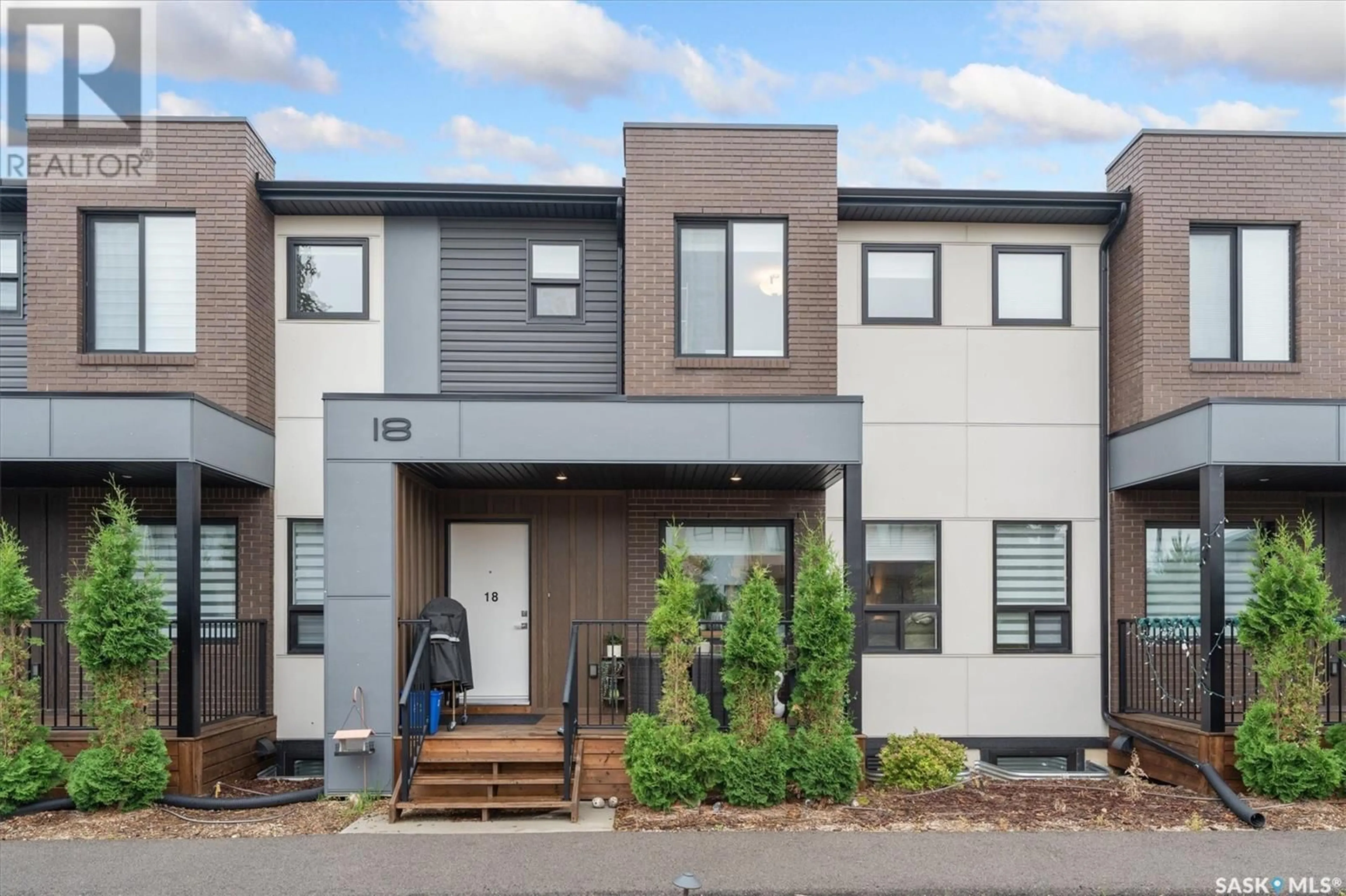 Home with brick exterior material, street for 18 619 EVERGREEN BOULEVARD, Saskatoon Saskatchewan S7W0Y3