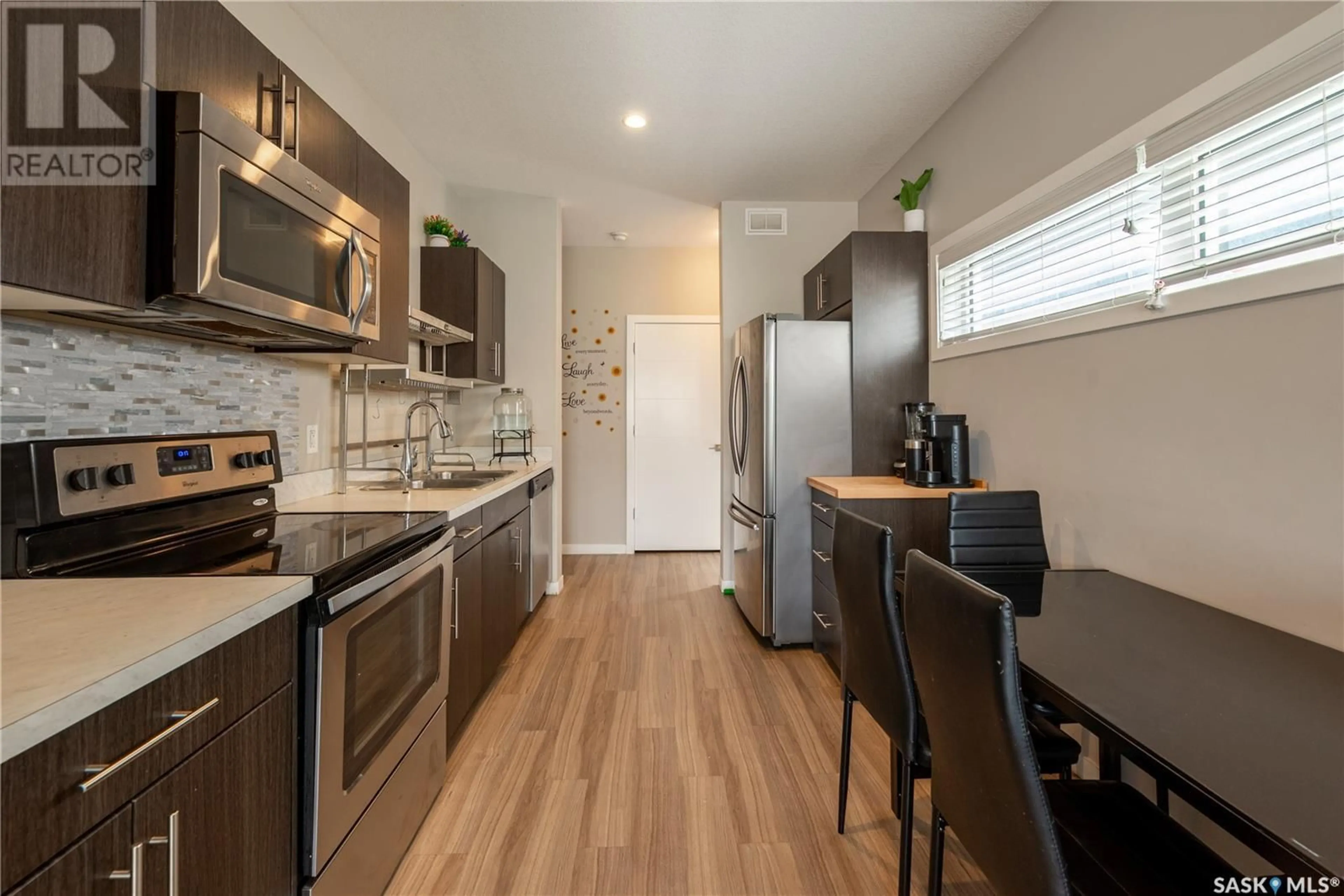 Open concept kitchen, wood/laminate floor for 3905 JAMES HILL ROAD, Regina Saskatchewan S4W0N8