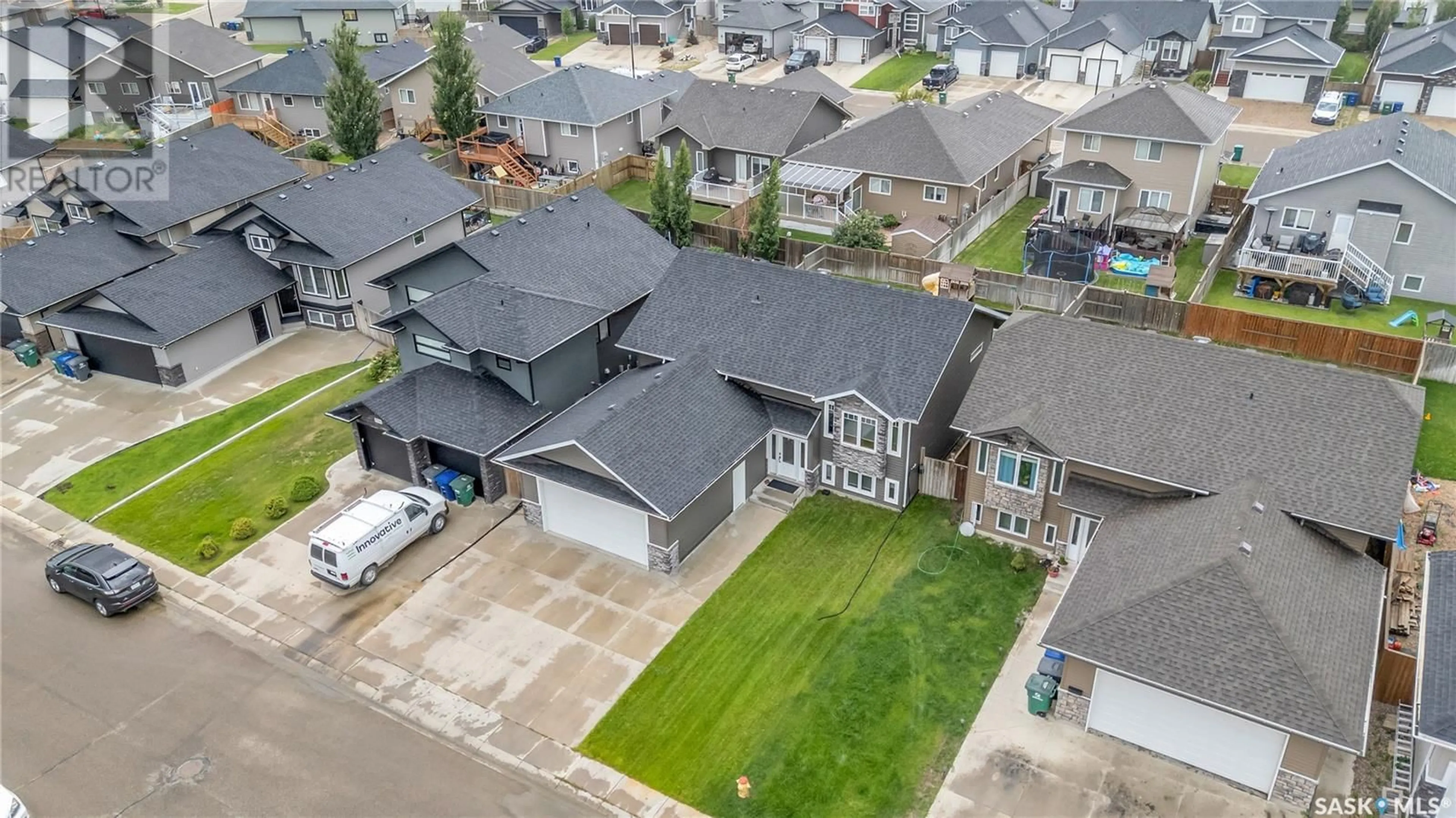 A pic from outside/outdoor area/front of a property/back of a property/a pic from drone, street for 1123 HARGREAVES WAY, Saskatoon Saskatchewan S7L0A1