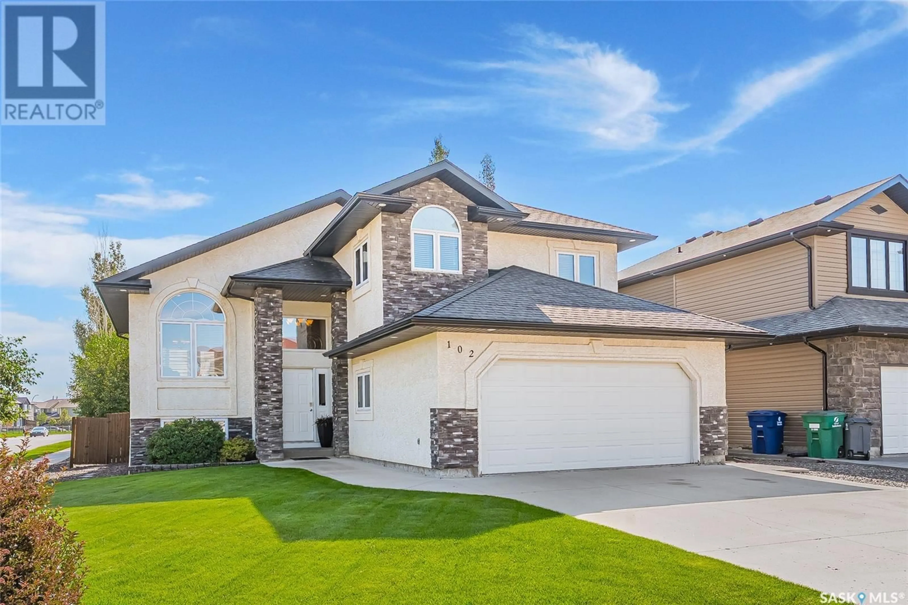Home with vinyl exterior material, street for 102 WILKINS CRESCENT, Saskatoon Saskatchewan S7W0C5