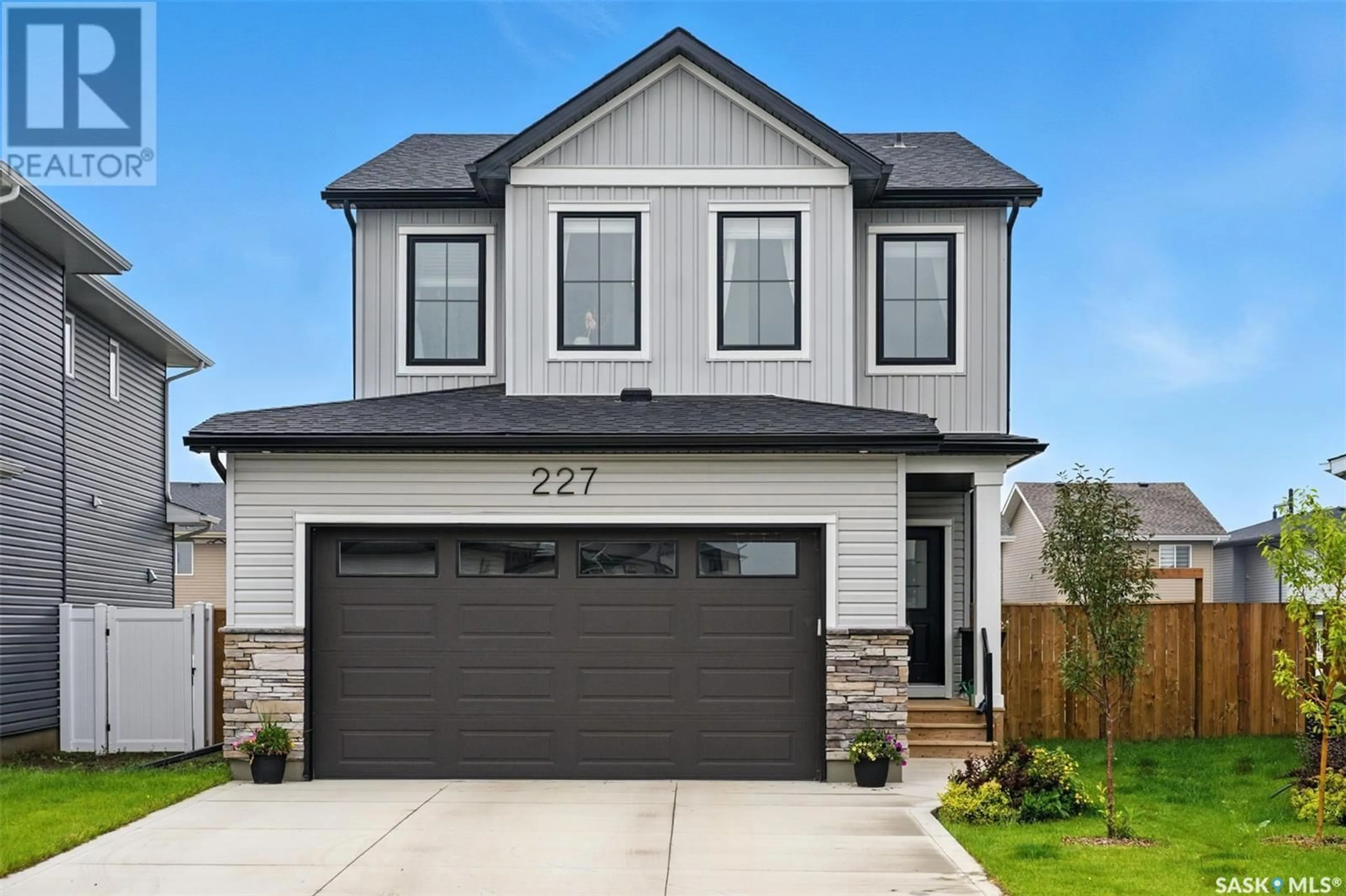 Home with vinyl exterior material, street for 227 PRASAD MANOR, Saskatoon Saskatchewan S7V1L4