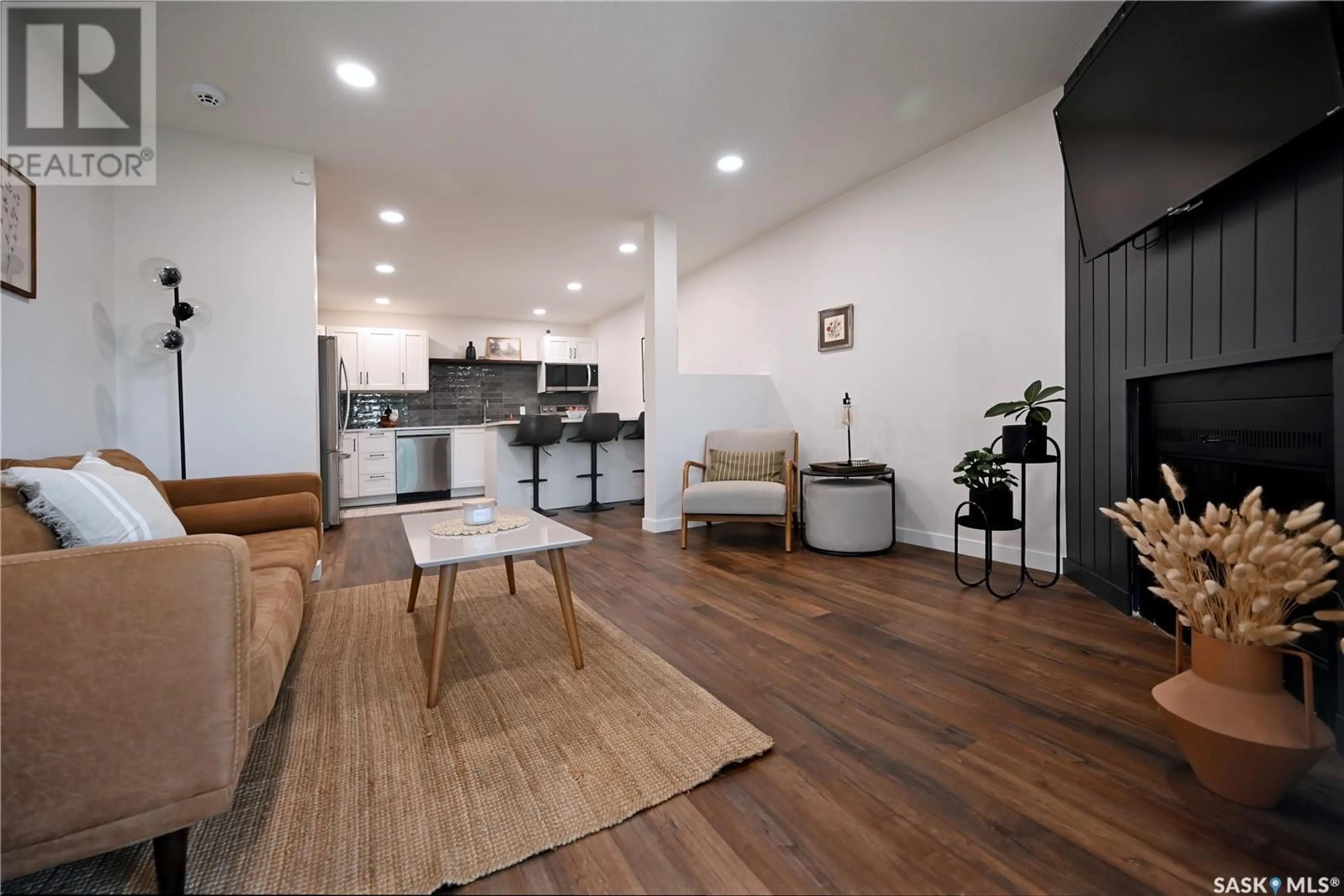 Open concept kitchen, wood/laminate floor for 306 - 307 PERKINS STREET, Estevan Saskatchewan S4A2K1