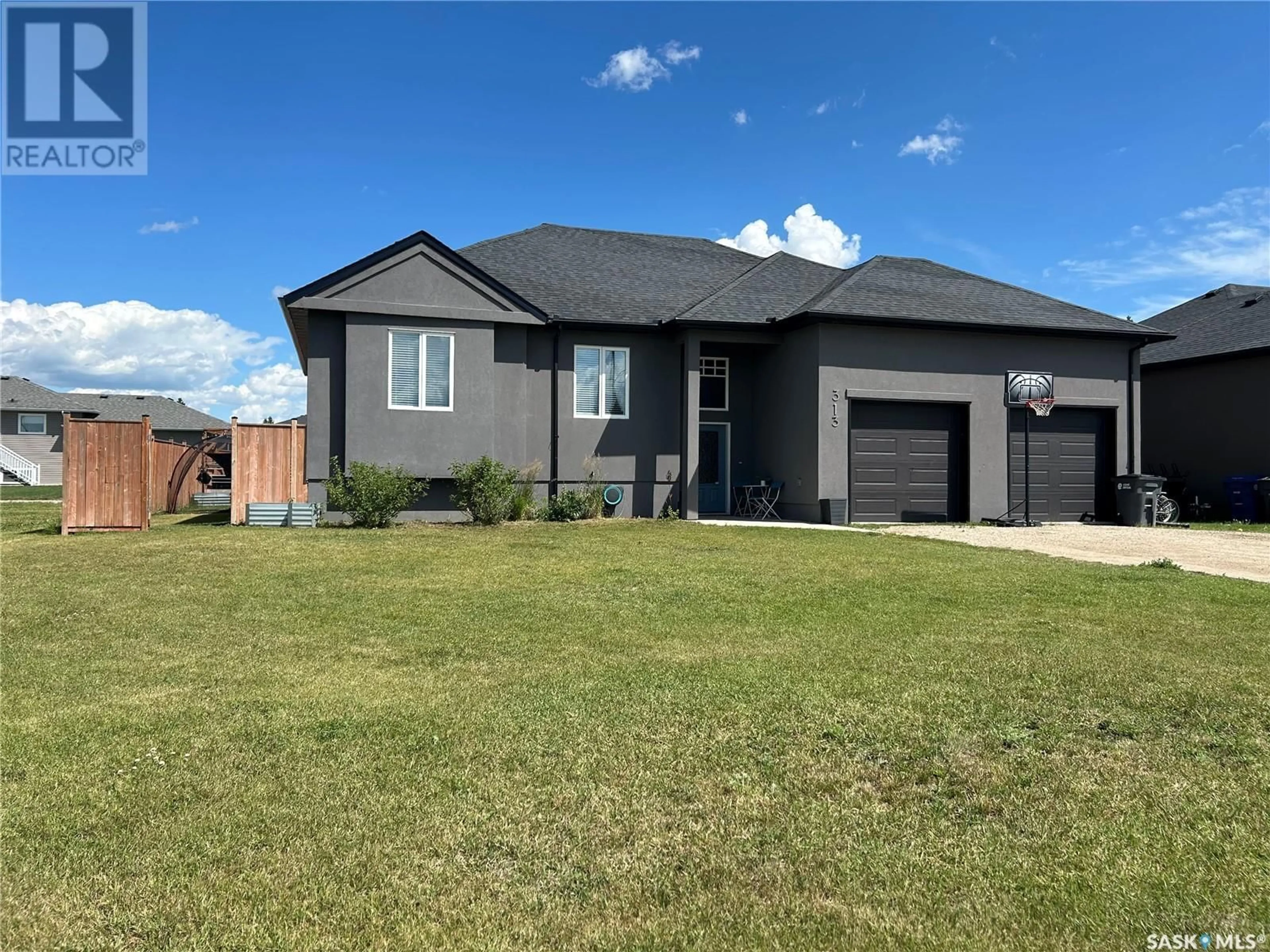 Home with brick exterior material, street for 313 COOK ROAD, Moosomin Saskatchewan S0G3N0