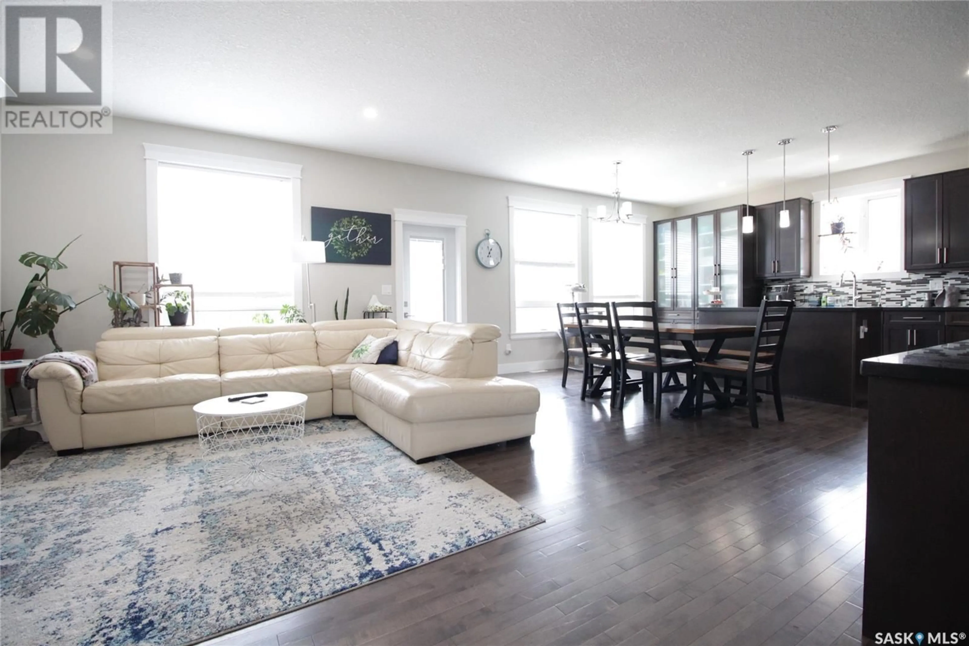 Living room with furniture, wood/laminate floor for 313 COOK ROAD, Moosomin Saskatchewan S0G3N0