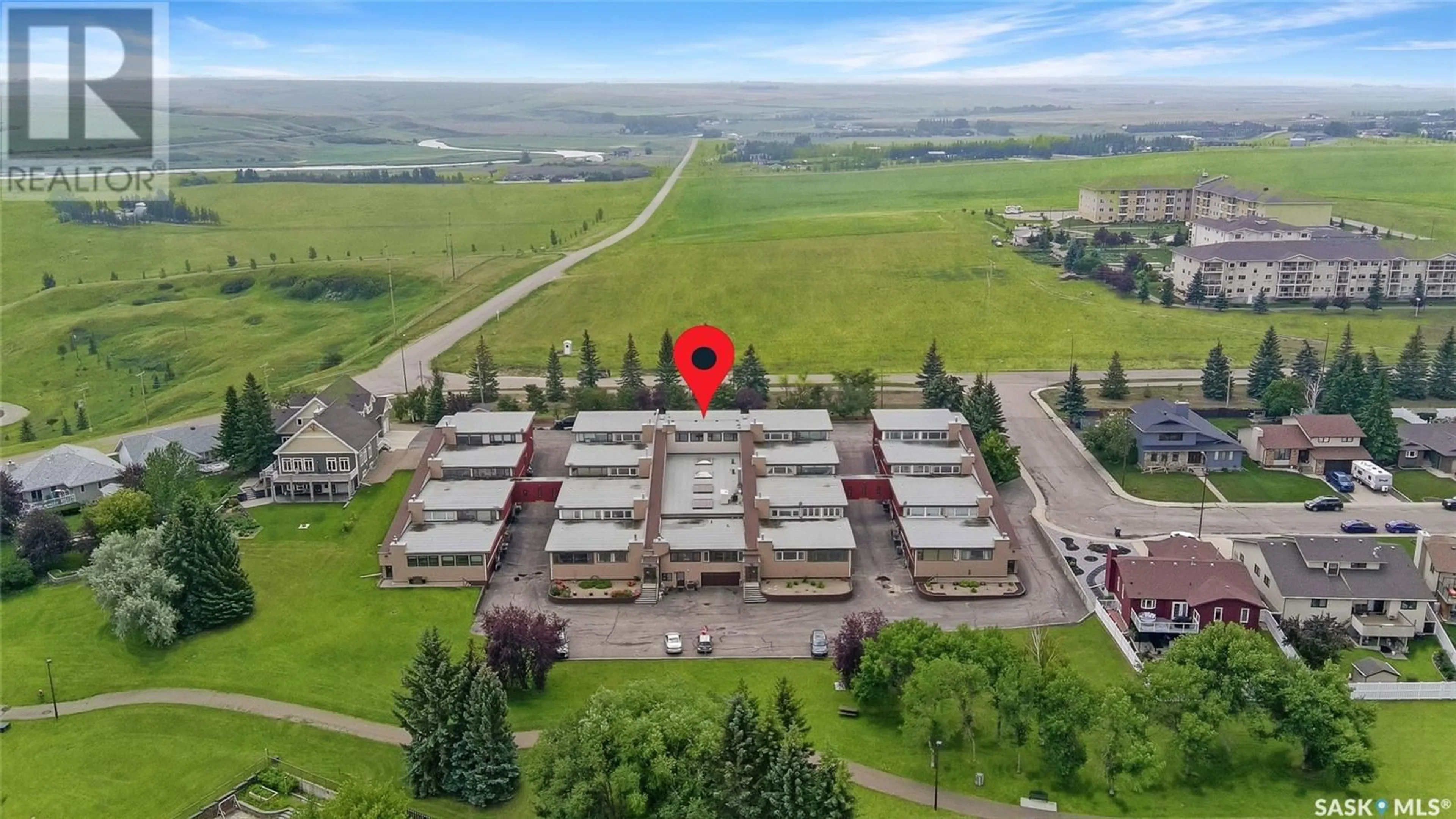 A pic from outside/outdoor area/front of a property/back of a property/a pic from drone, building for 9 275 ALPINE CRESCENT, Swift Current Saskatchewan S9H4Y8