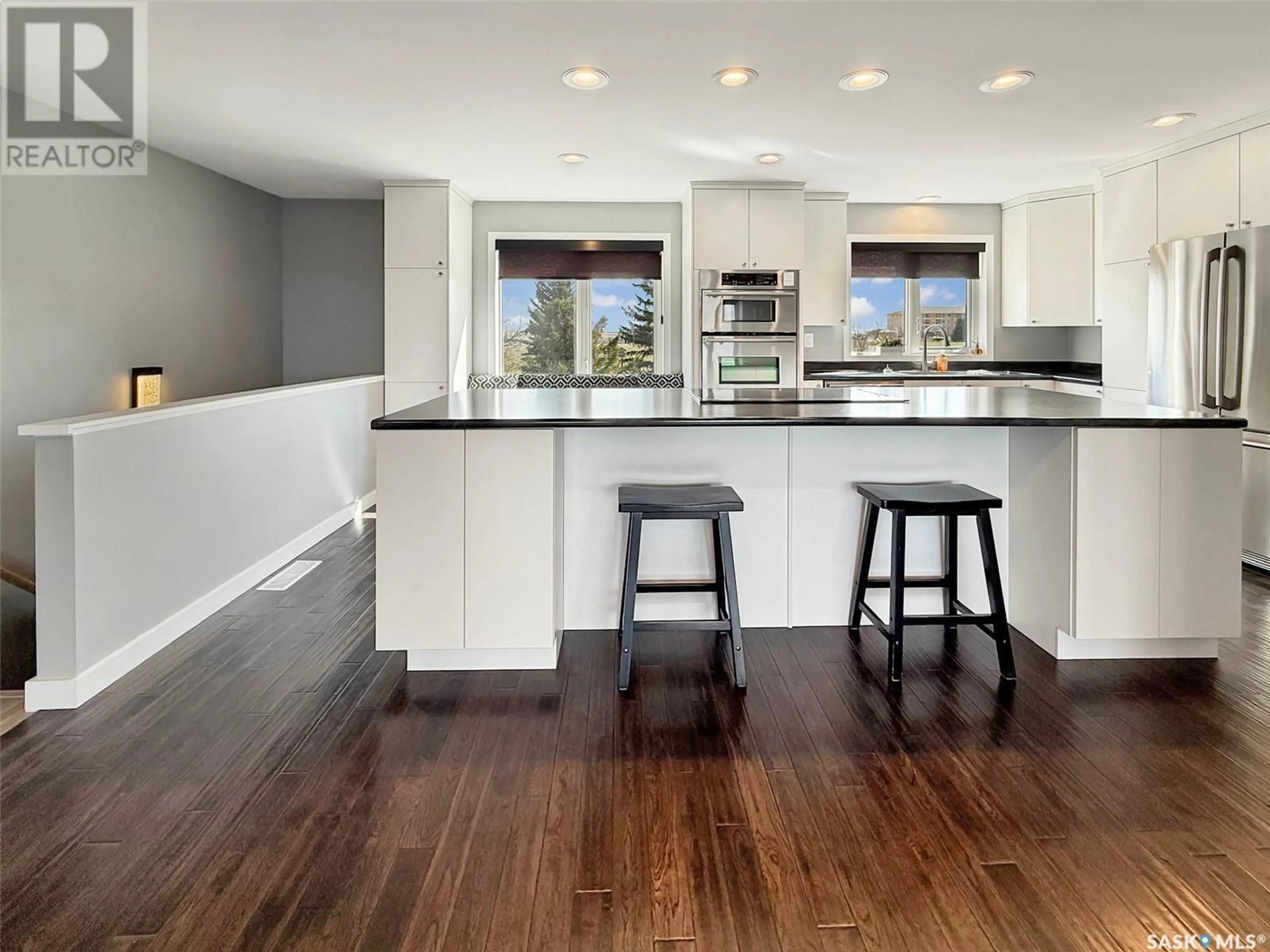 Open concept kitchen, wood/laminate floor for 9 275 ALPINE CRESCENT, Swift Current Saskatchewan S9H4Y8