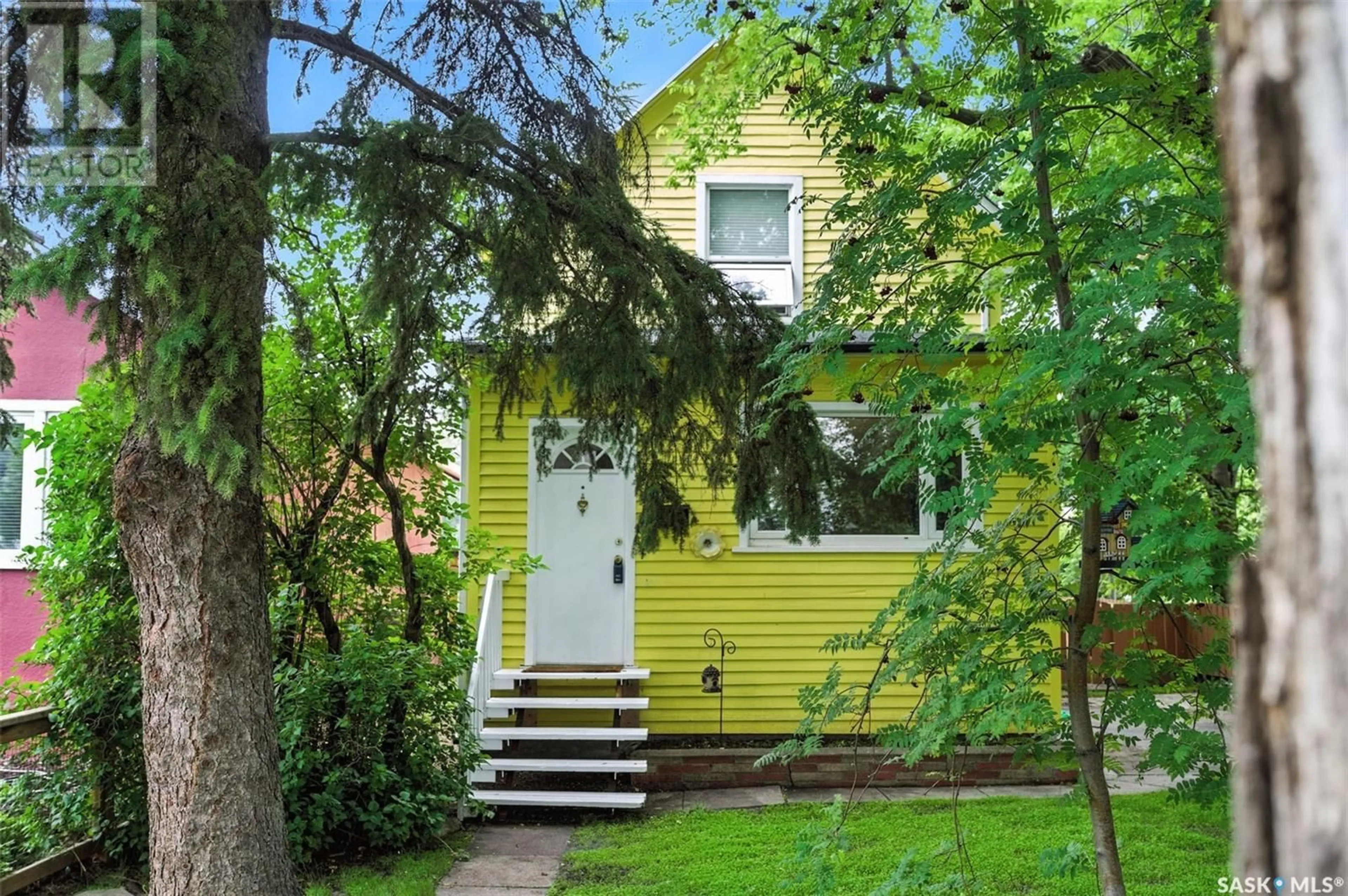 Home with vinyl exterior material, street for 703 7TH STREET, Saskatoon Saskatchewan S7H0Y1